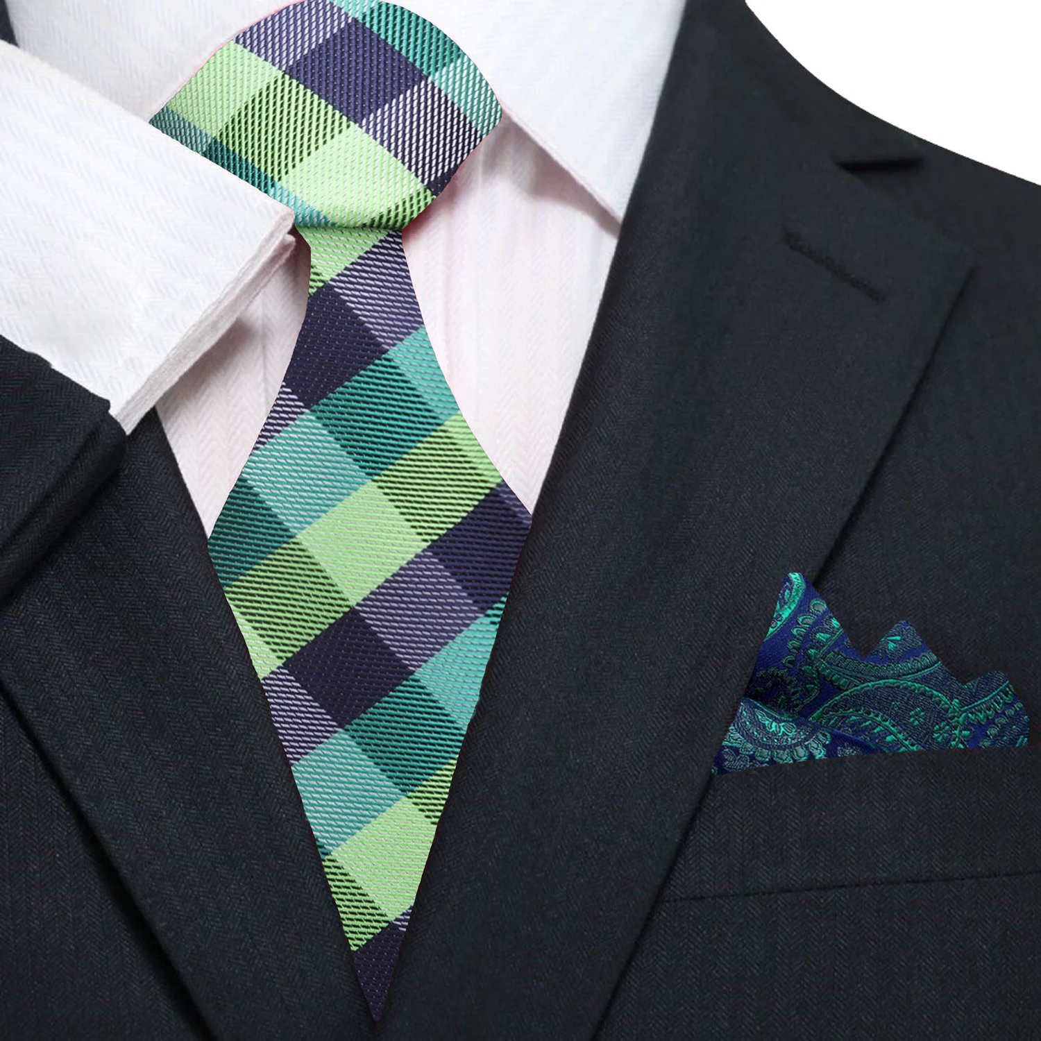 Man wearing a stylish green necktie with a navy suit at a wedding
