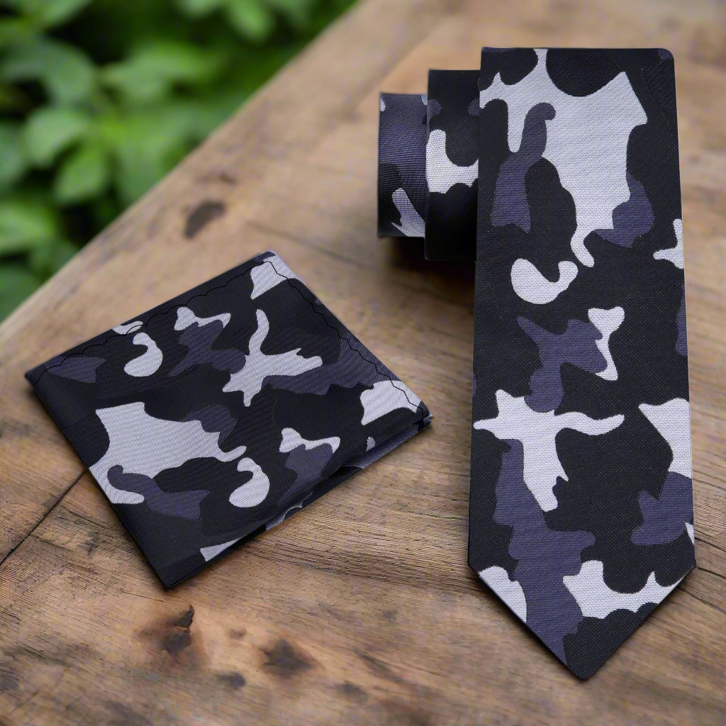 Silk tie paired with a classic black suit for an elegant look at a formal event.