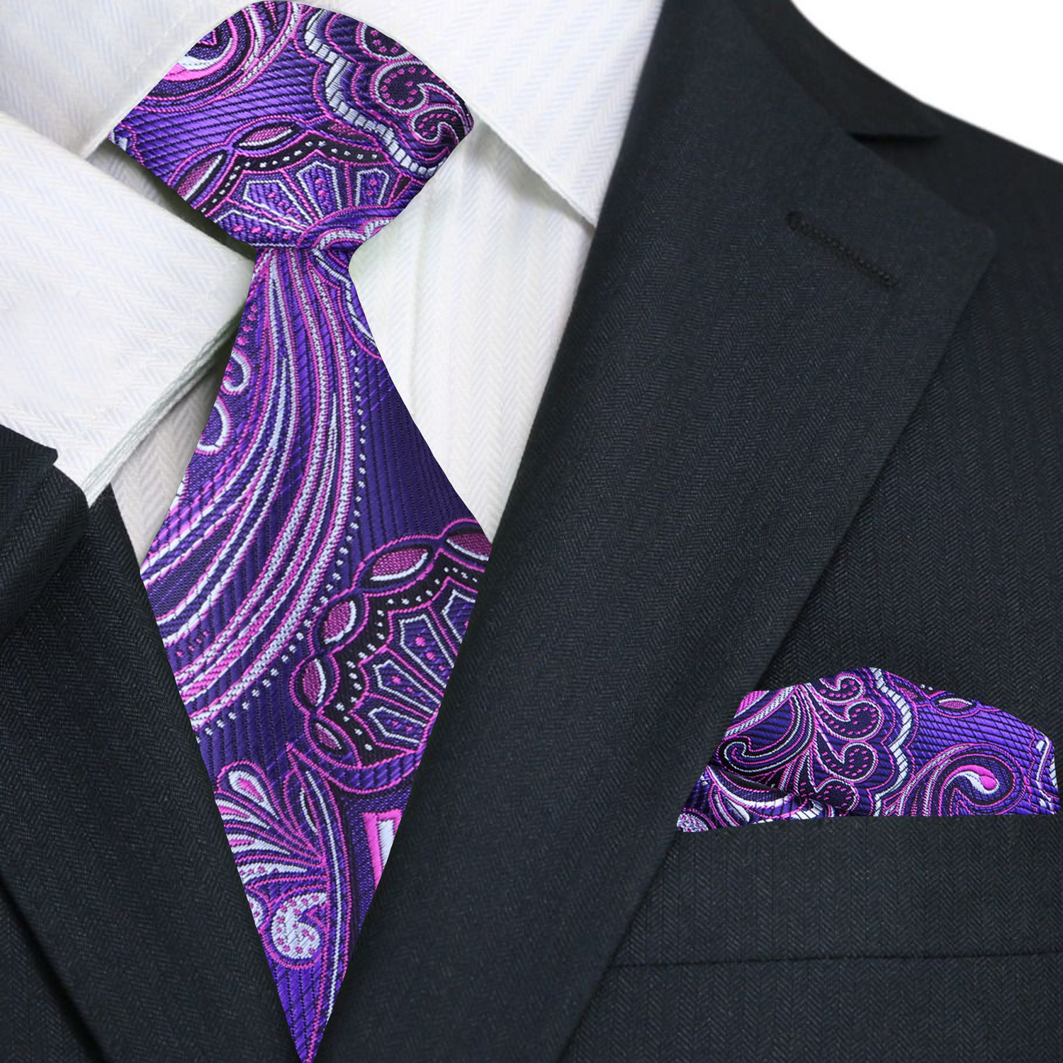 Close-up of the elegant purple paisley silk necktie highlighting its intricate design.