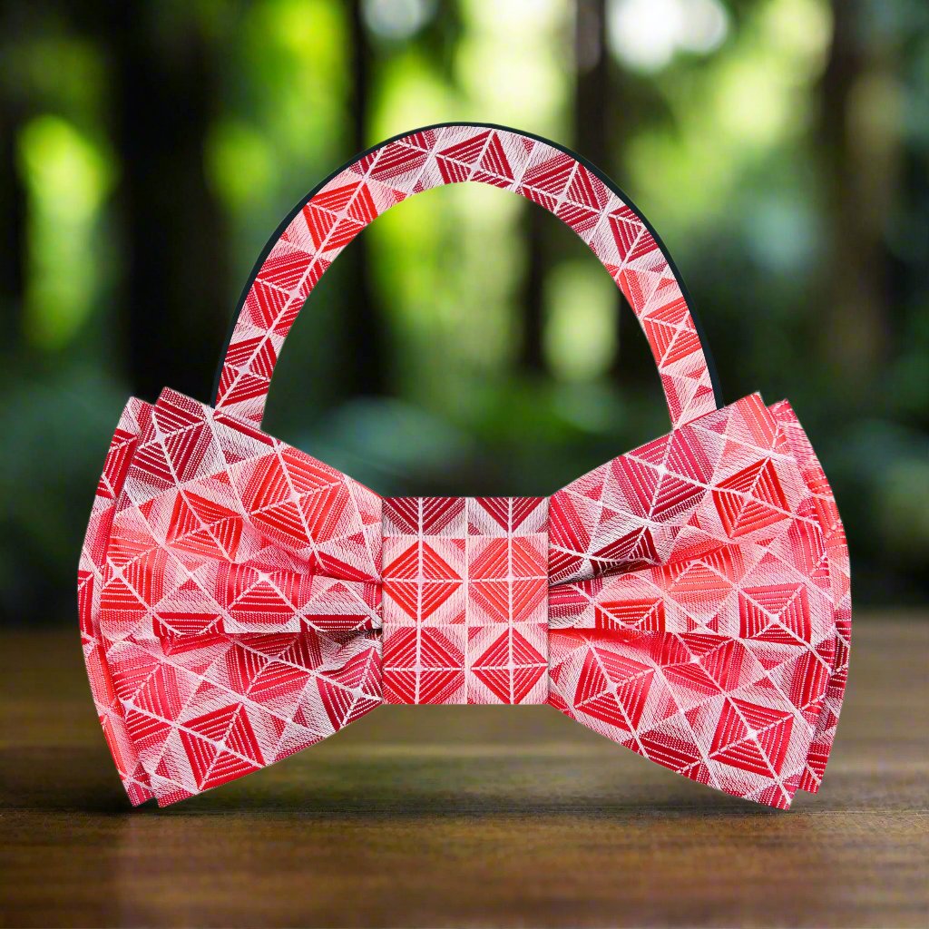 Front view of a stylish red geometric bow tie on a mannequin for formal wear