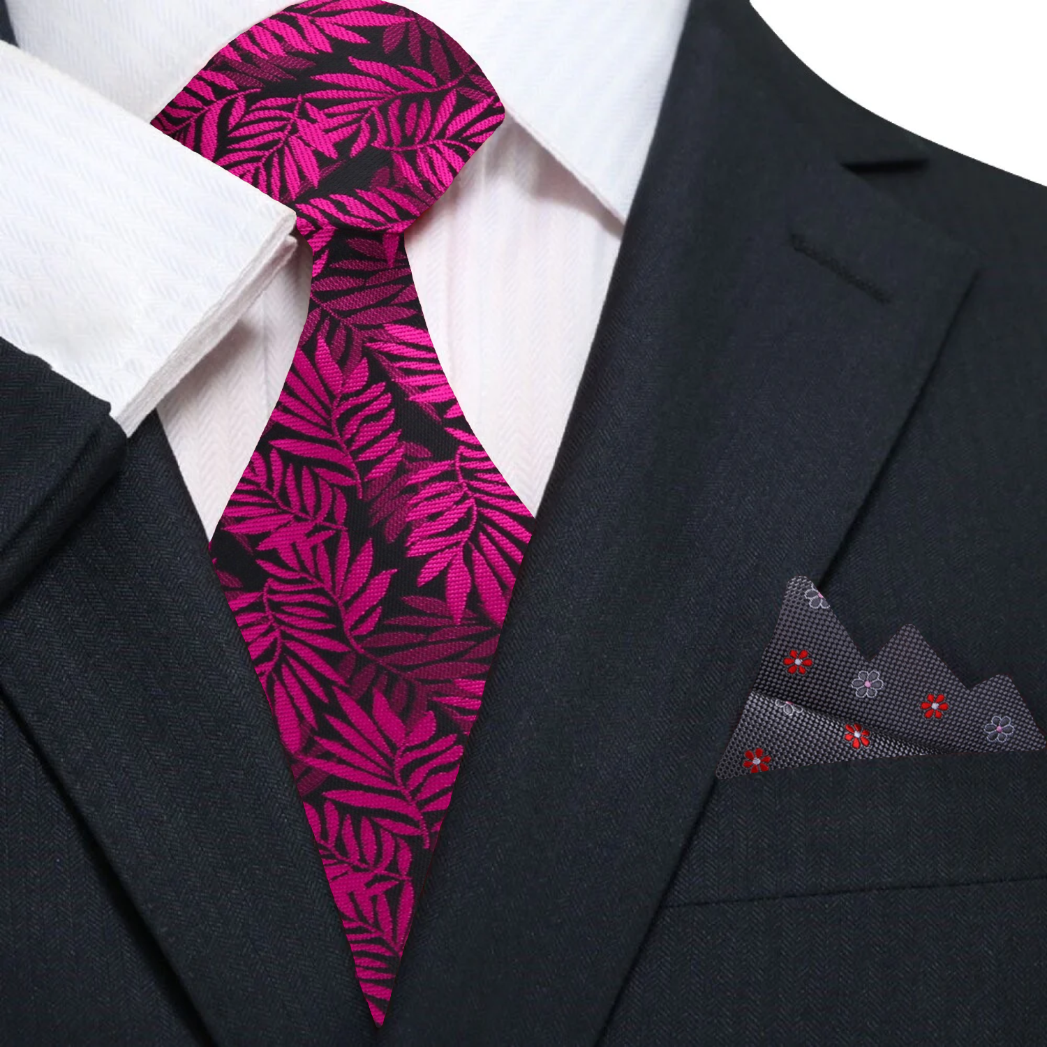 Close-up of a patterned silk tie in shades of red and pink, suitable for dressy occasions
