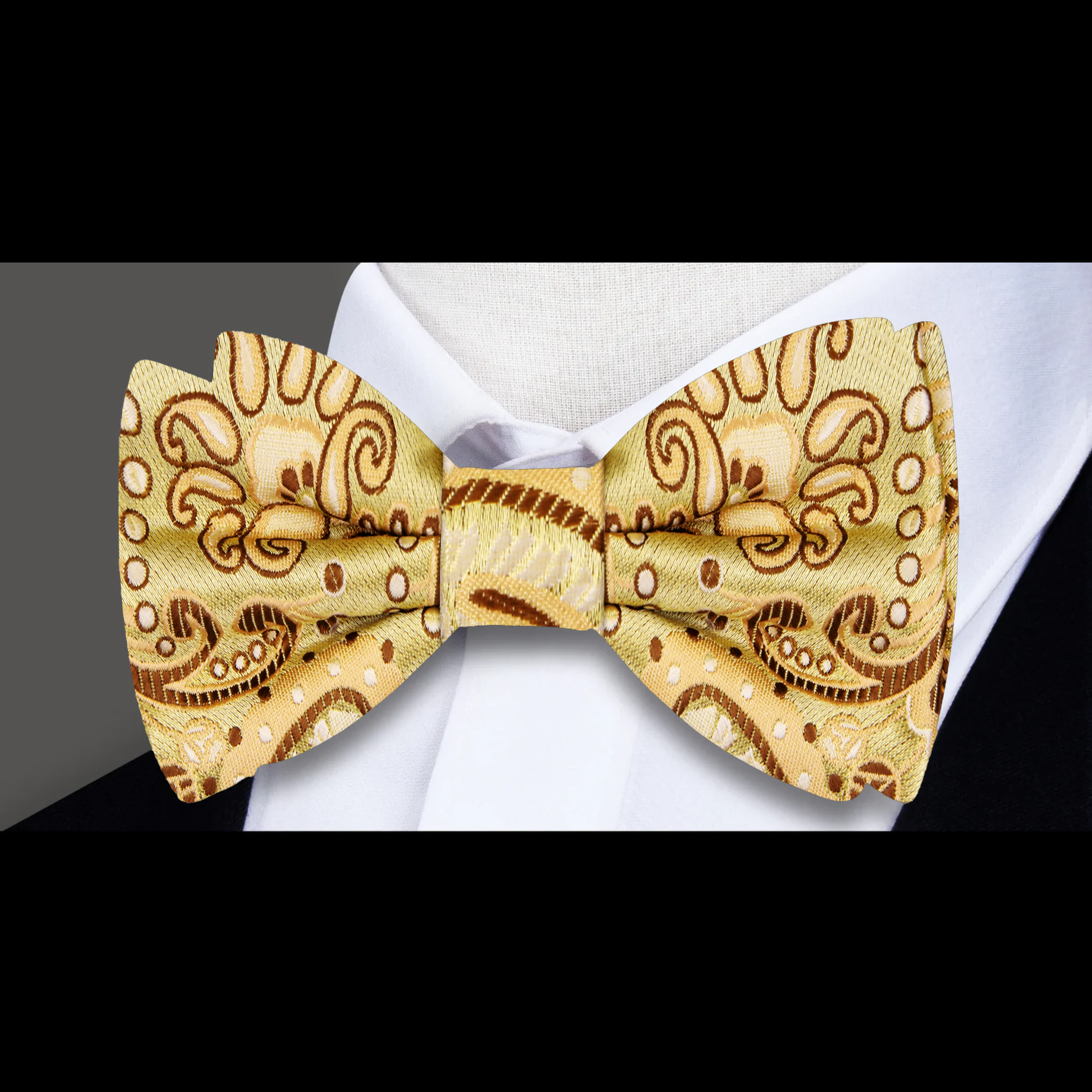 Elegant light yellow paisley bow tie worn with a white dress shirt for a formal event