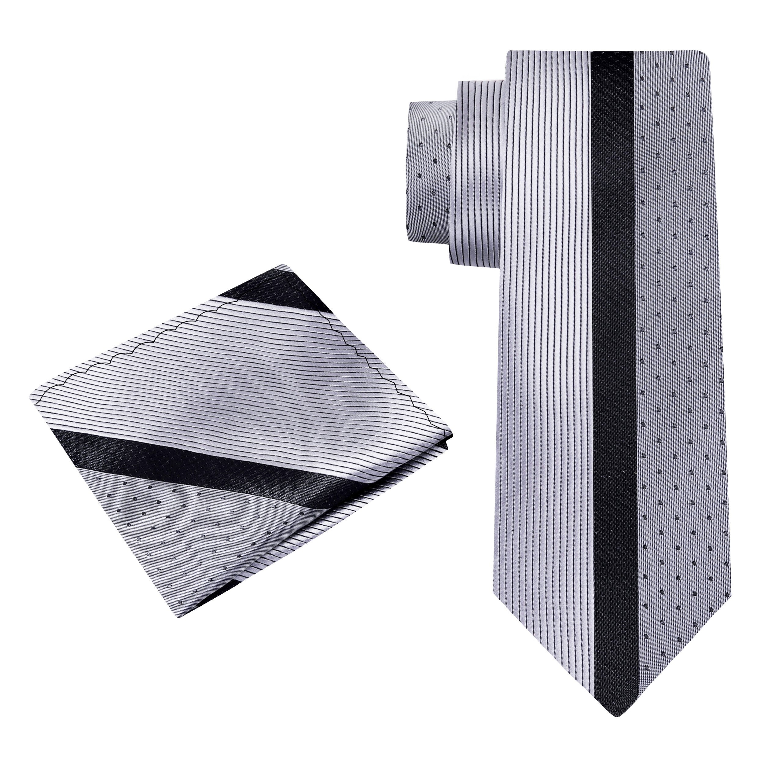 Close-up of the grey silk necktie with pocket square, highlighting the fine craftsmanship.