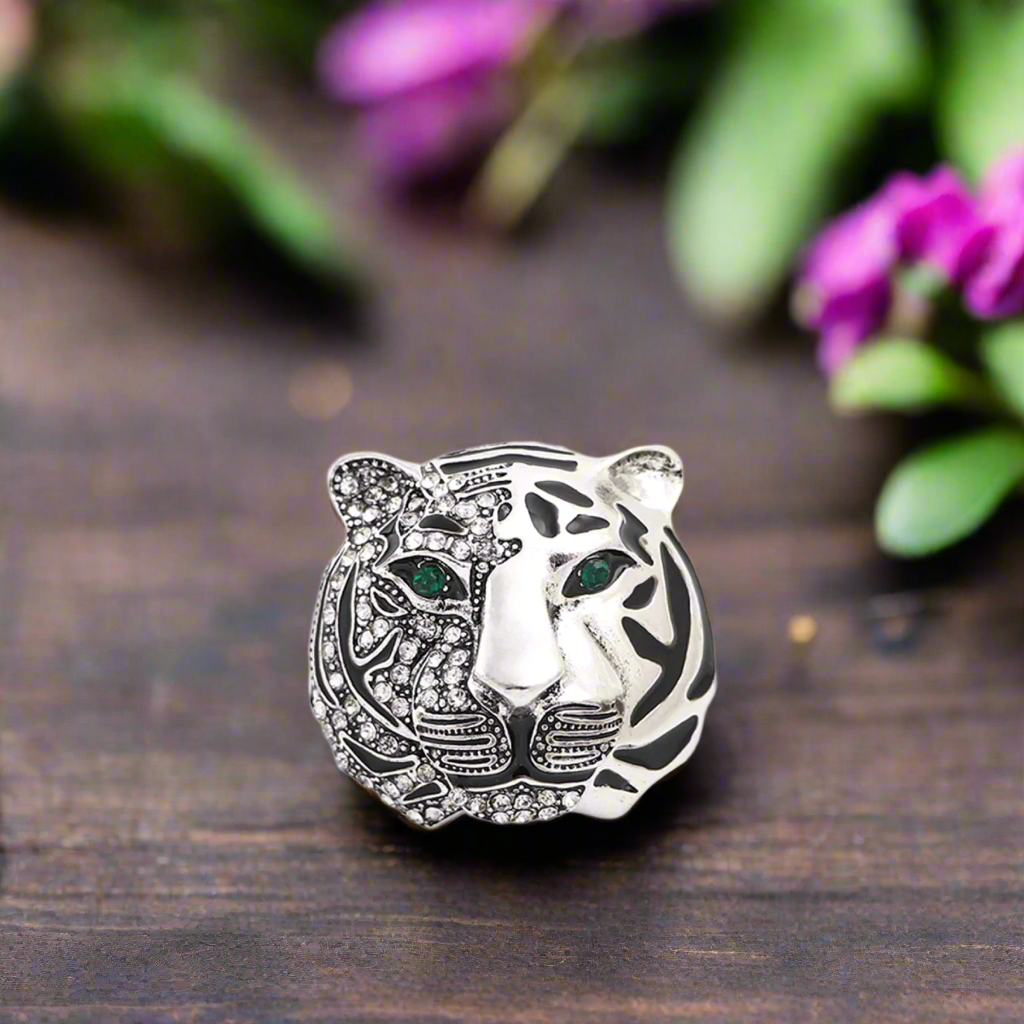 Man wearing a silver tiger pin on his suit lapel for a formal event, showcasing style and confidence