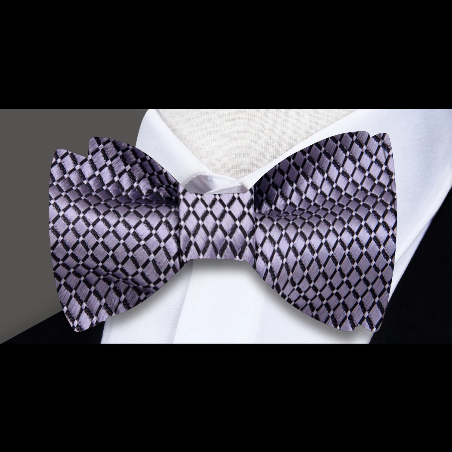 Elegant silk bow tie with small check pattern in gold and blue dots, ideal for weddings