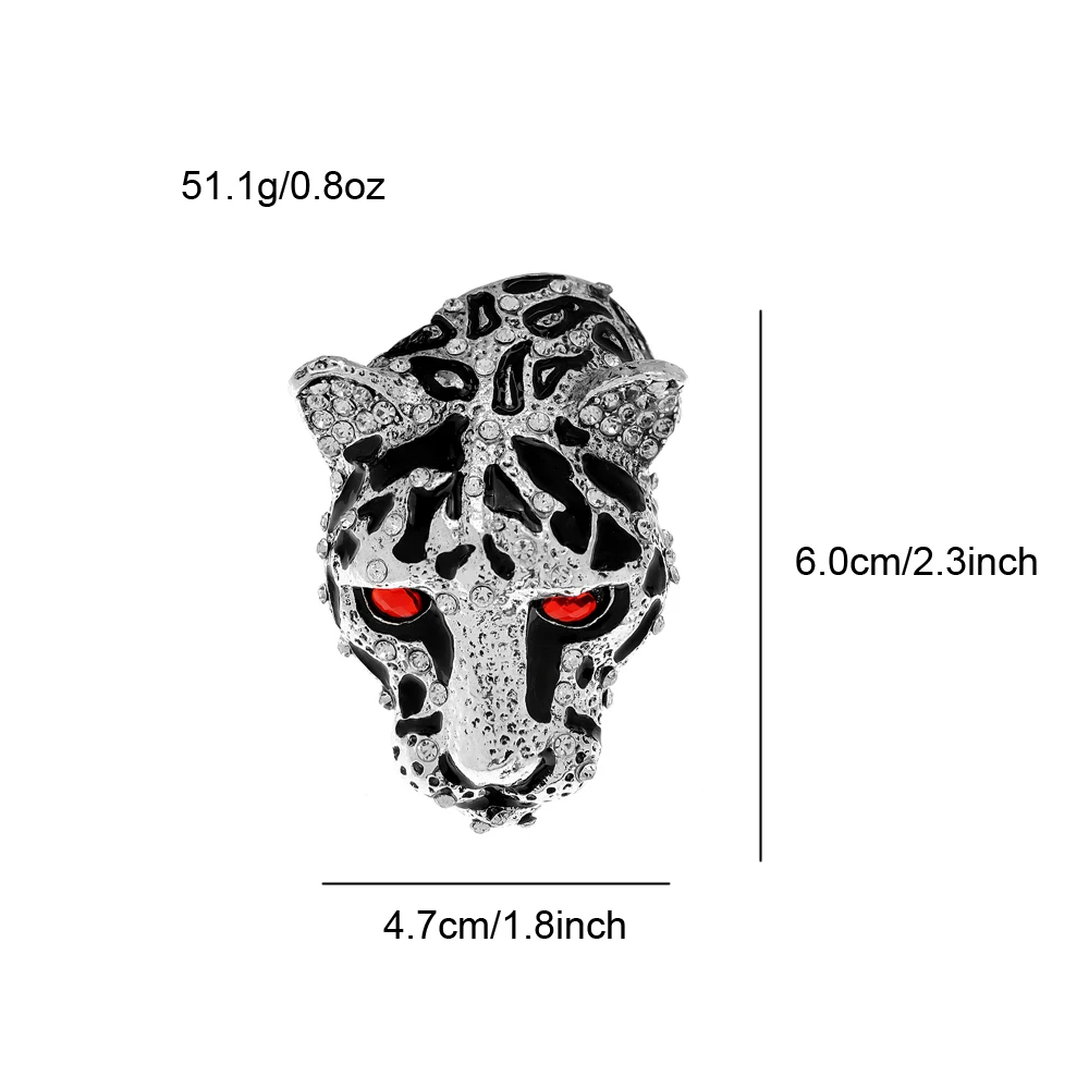 Close-up of the Leopard Head Lapel Pin featuring red and clear gemstones.
