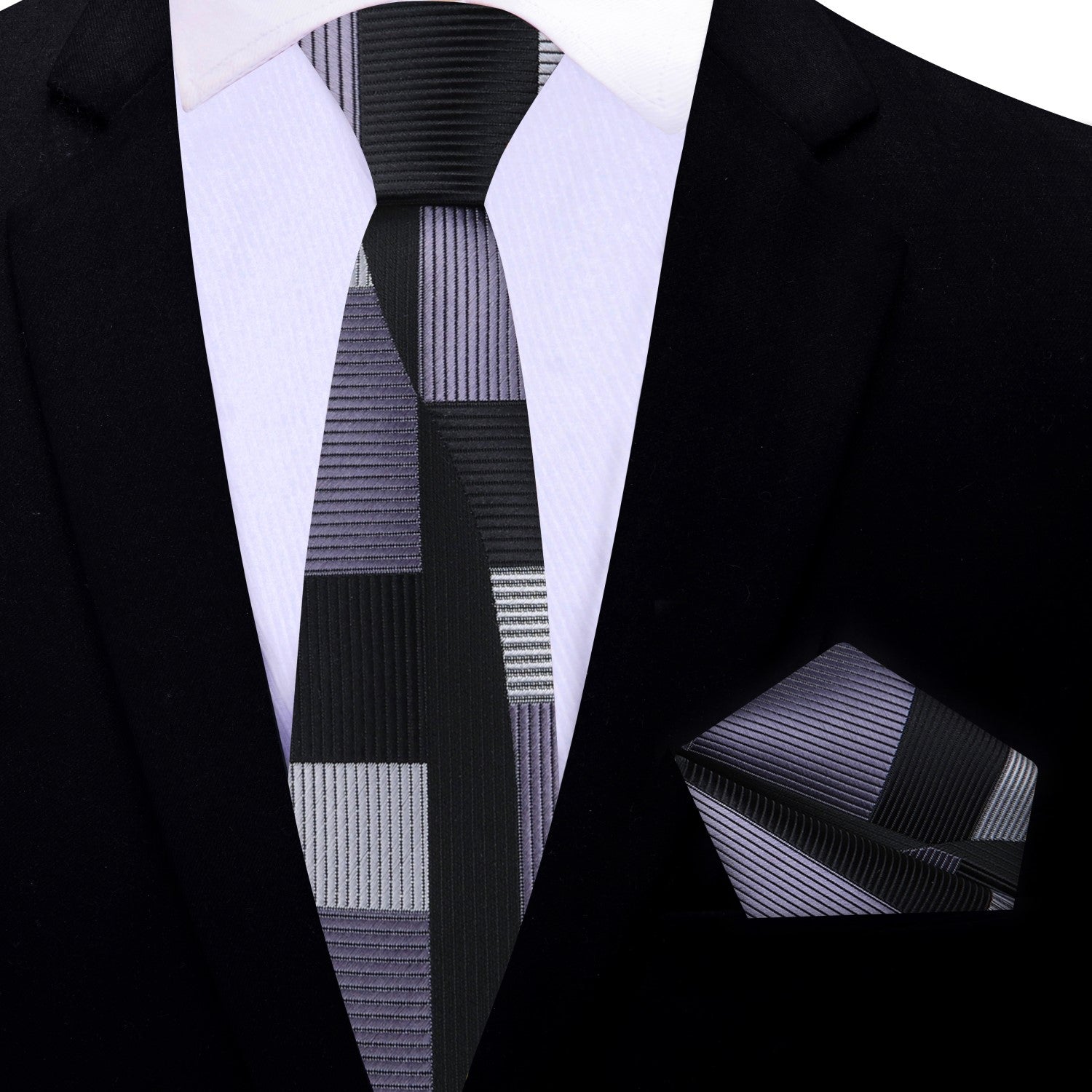 Man wearing a luxury mens tie and pocket square set at a networking event