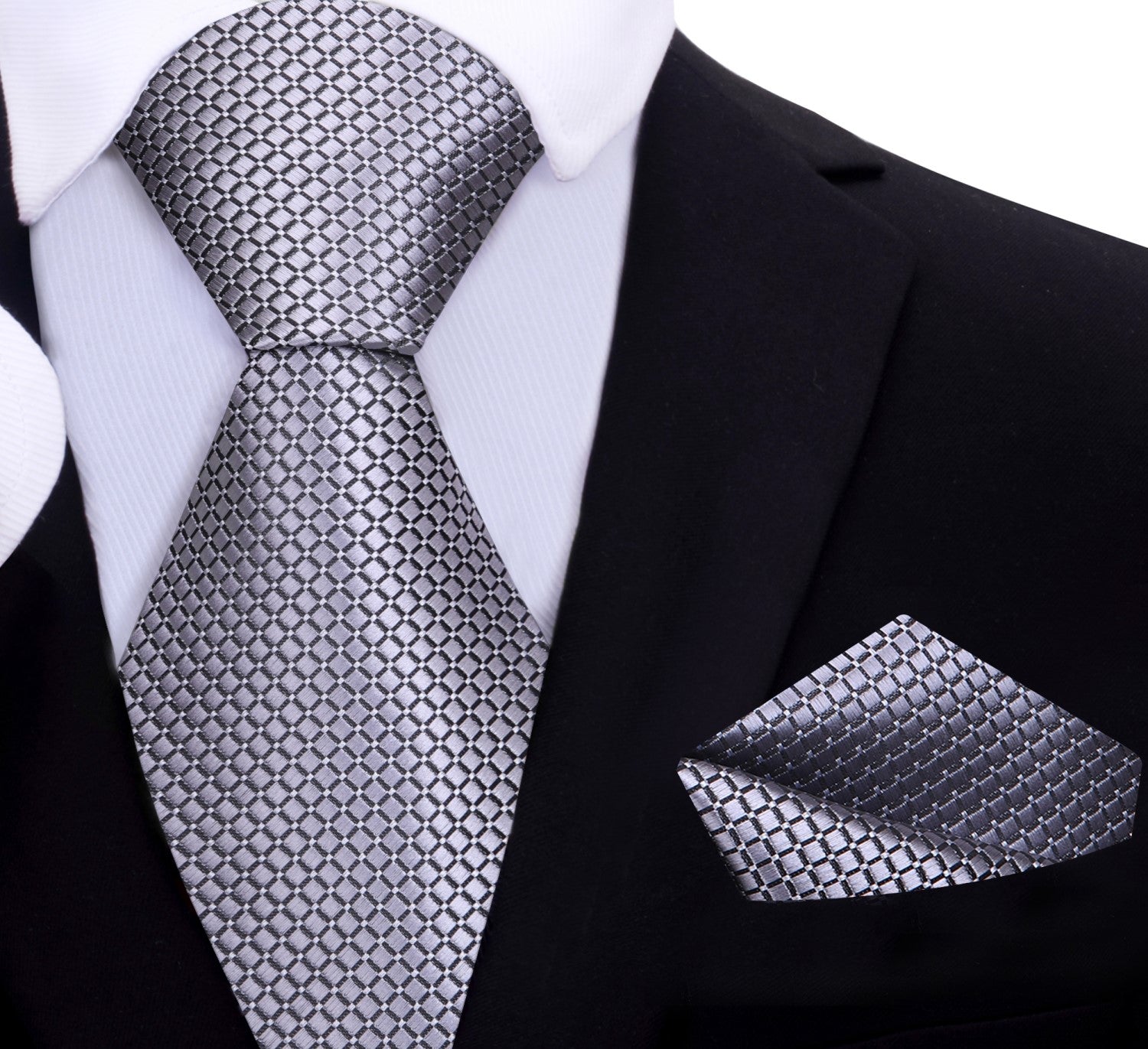 Man wearing a metallic geometric textured silk necktie at a wedding