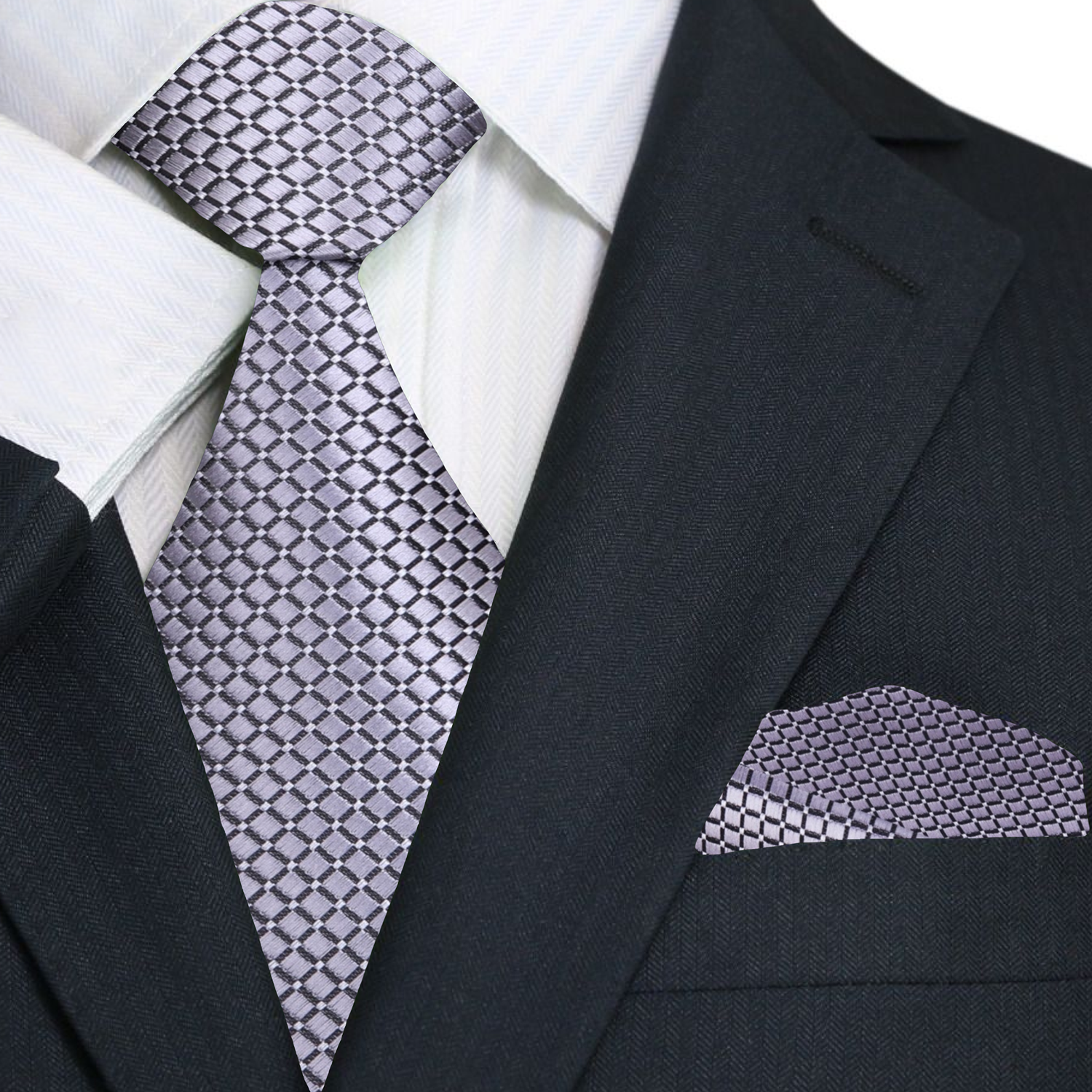 A model wearing the elegant silver geometric necktie paired with a crisp white dress shirt for a formal event.
