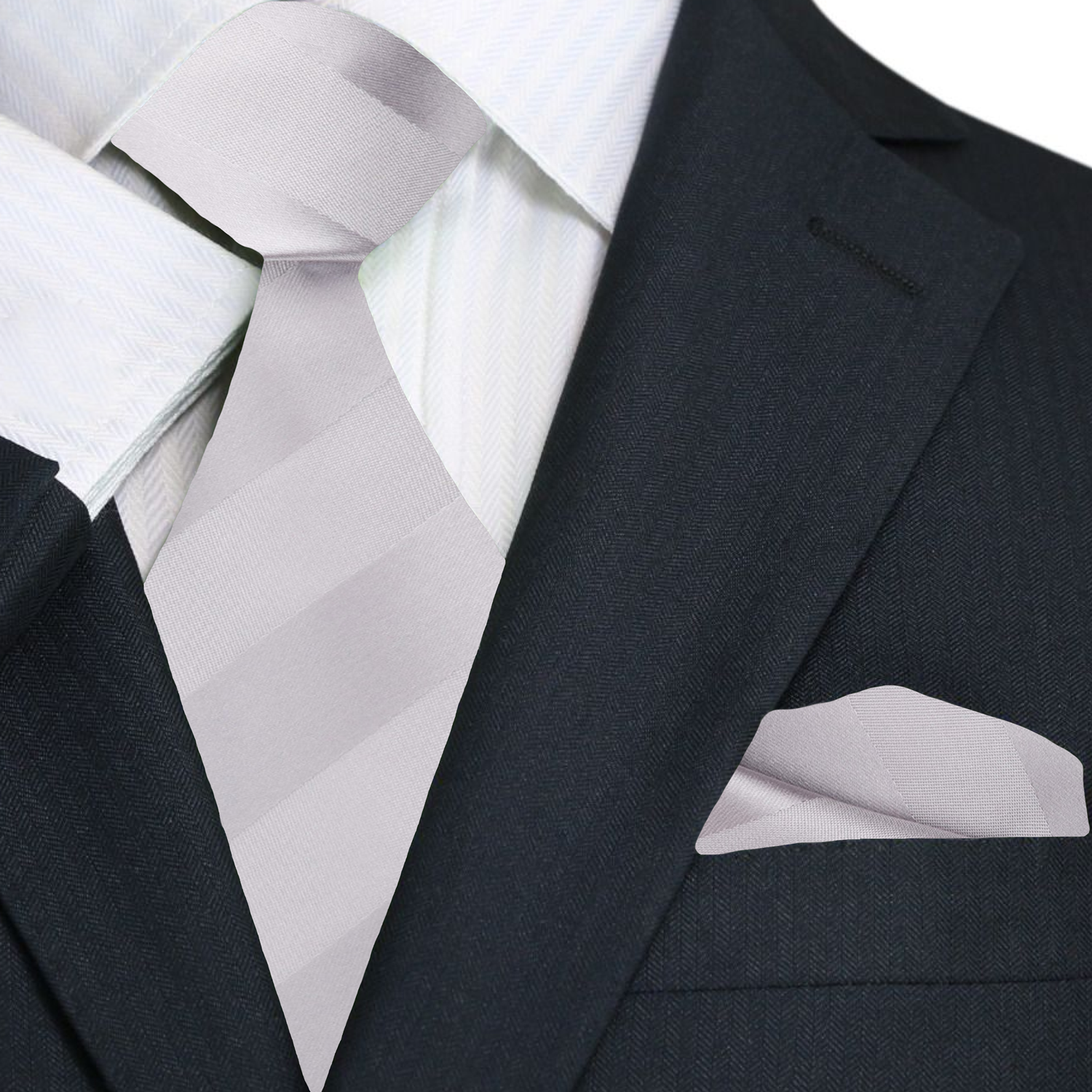 Mens silver silk tie paired with white dress shirt and grey suit