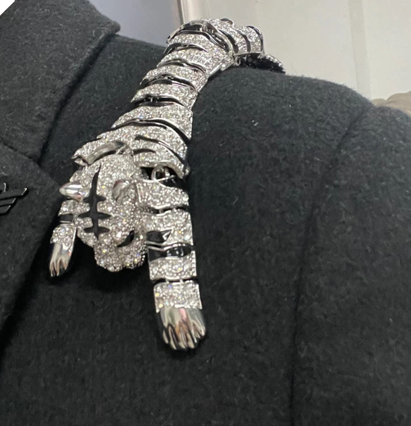 Close-up view of the Majestic Tiger Shoulder Lapel Pin in gold finish, highlighting intricate details and gemstones.