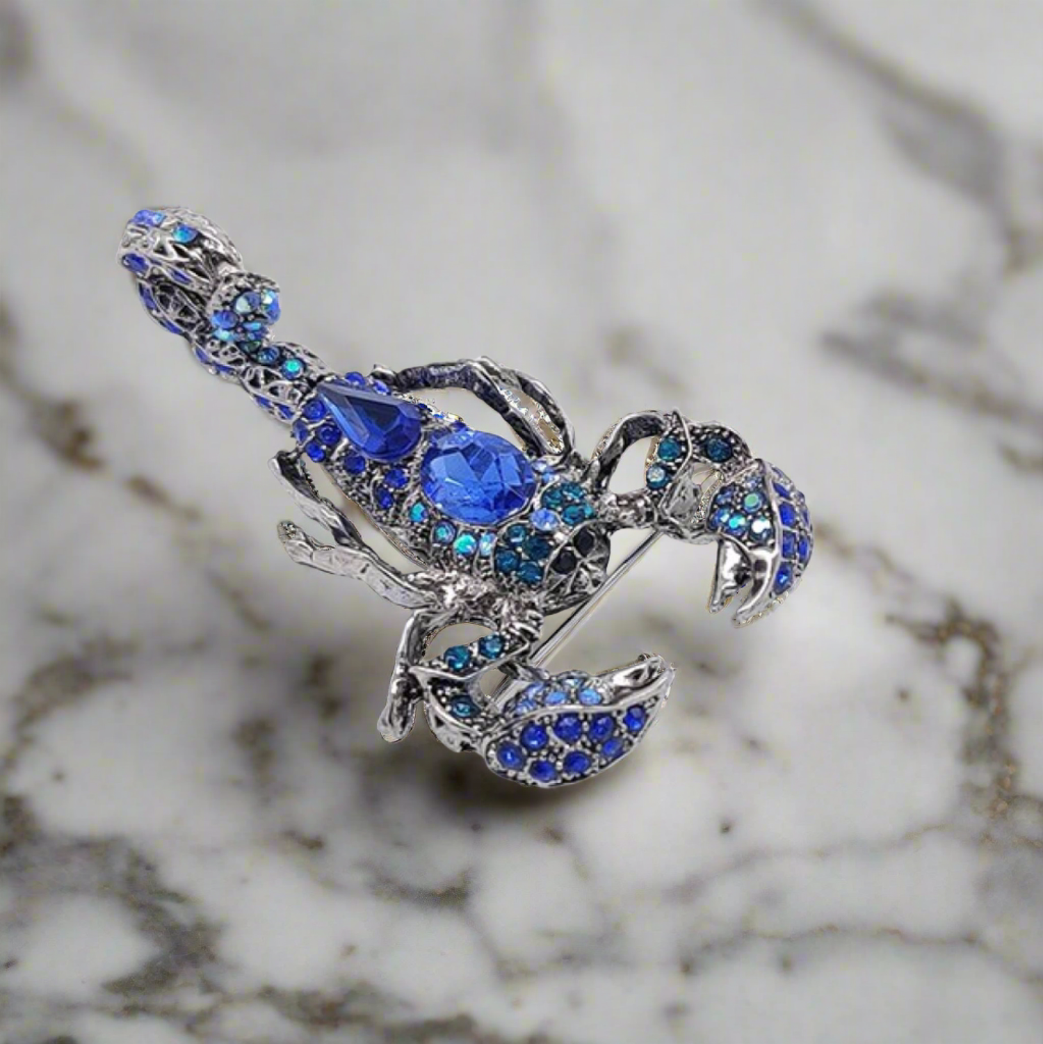 Close-up of a gemstone exotic animal pin with vibrant colors, ideal for fashion accessories and gifts