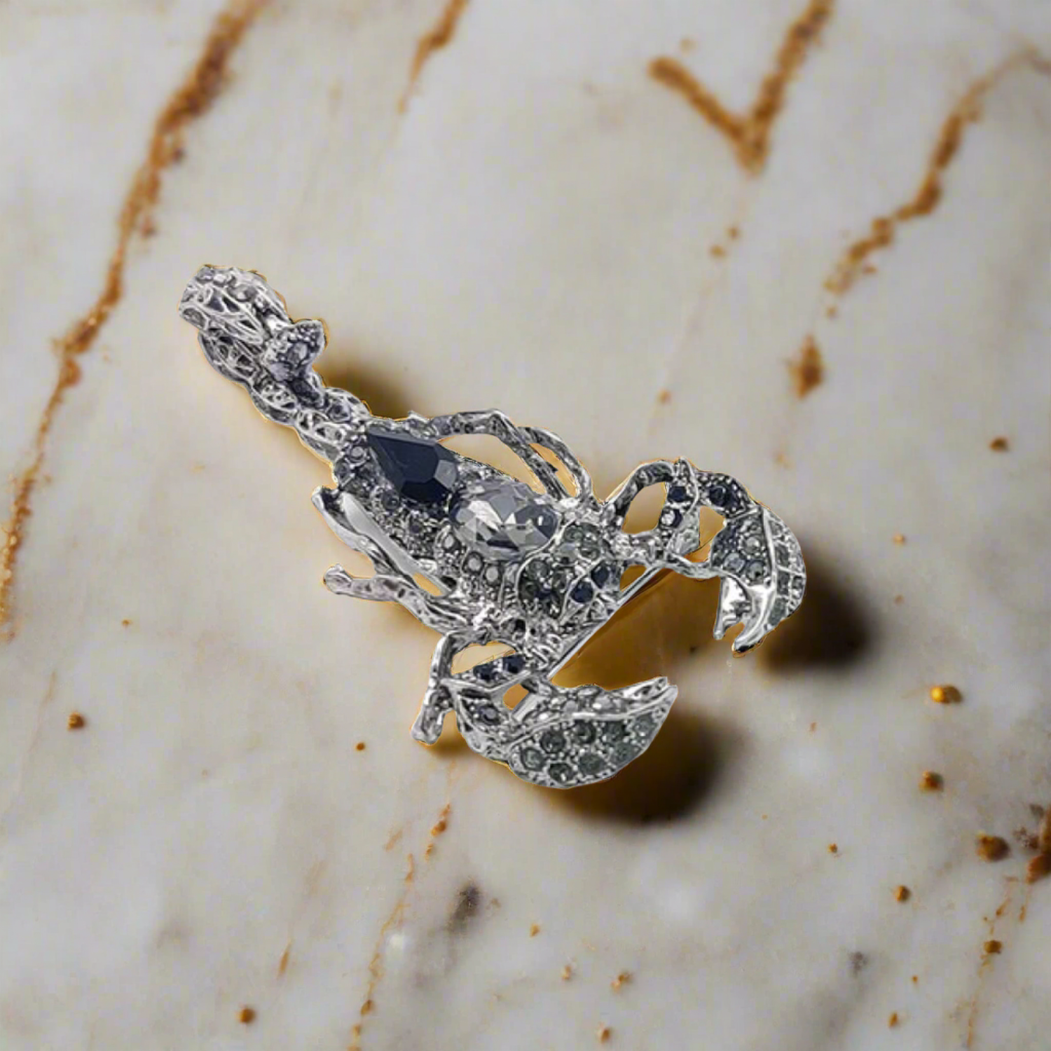 Styled image of a gemstone animal lapel pin attached to a blazer, highlighting its luxurious appearance