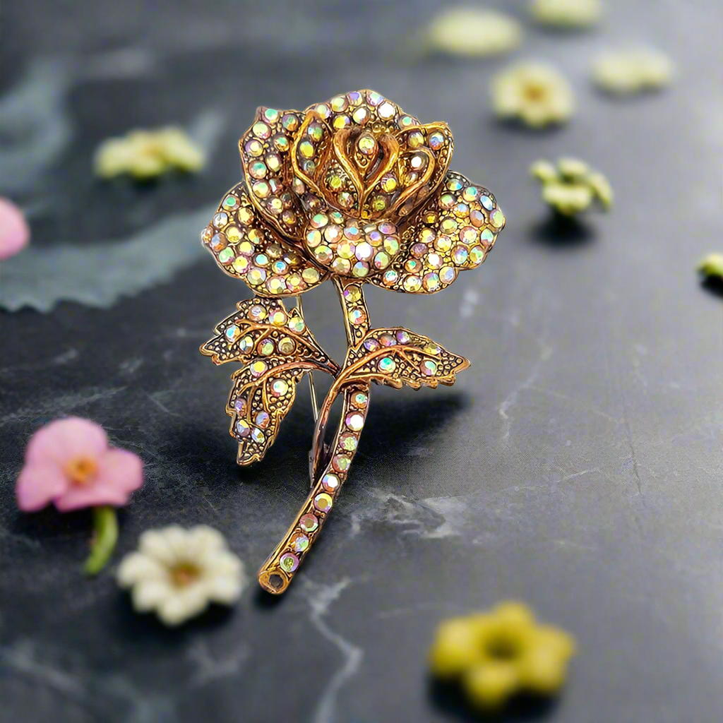 Close-up of the blue rose pin, perfect for formal attire.