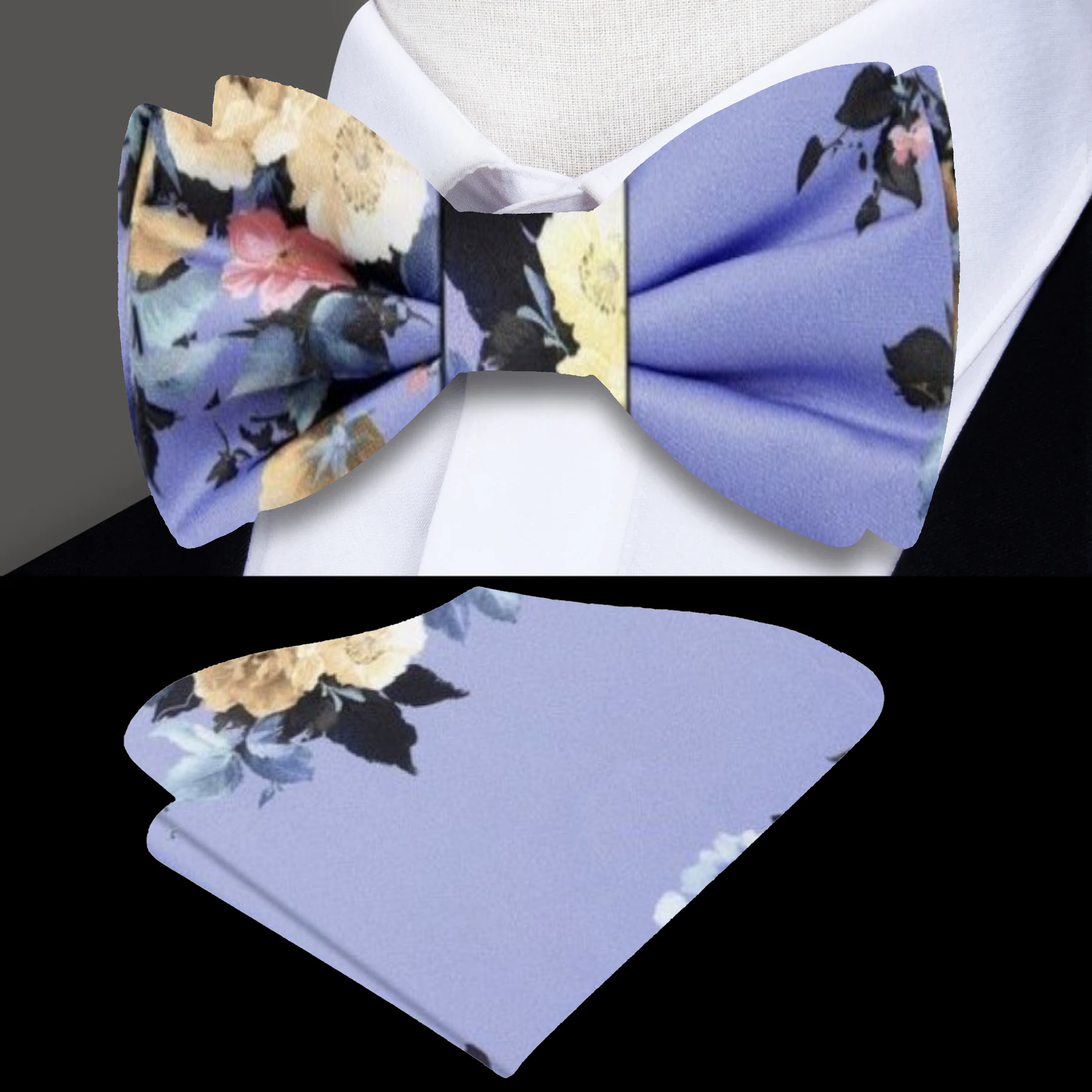 Close-up of silk floral bow tie in stormy gray with green and purple accents