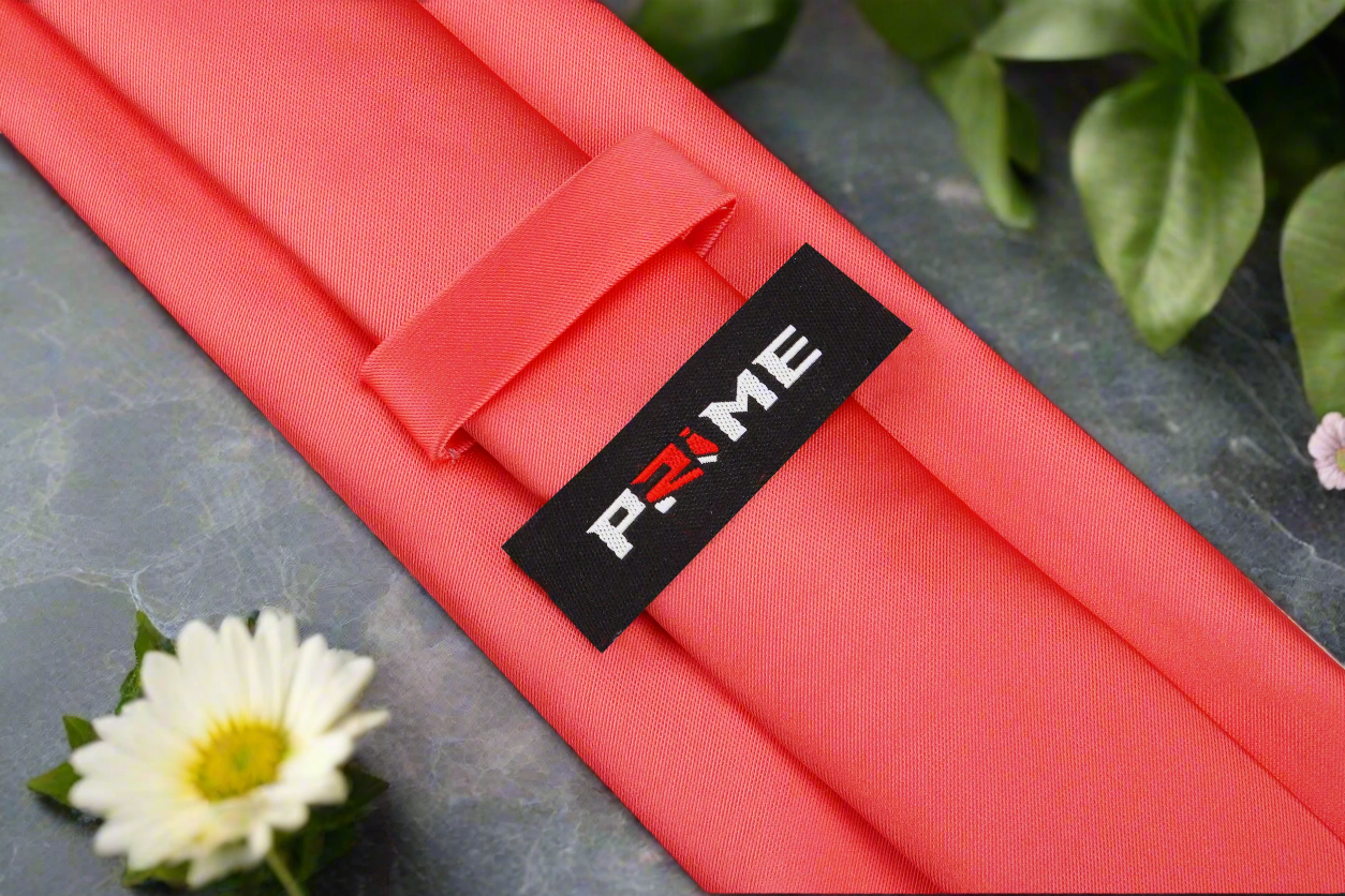 Slim coral necktie styled for a business meeting
