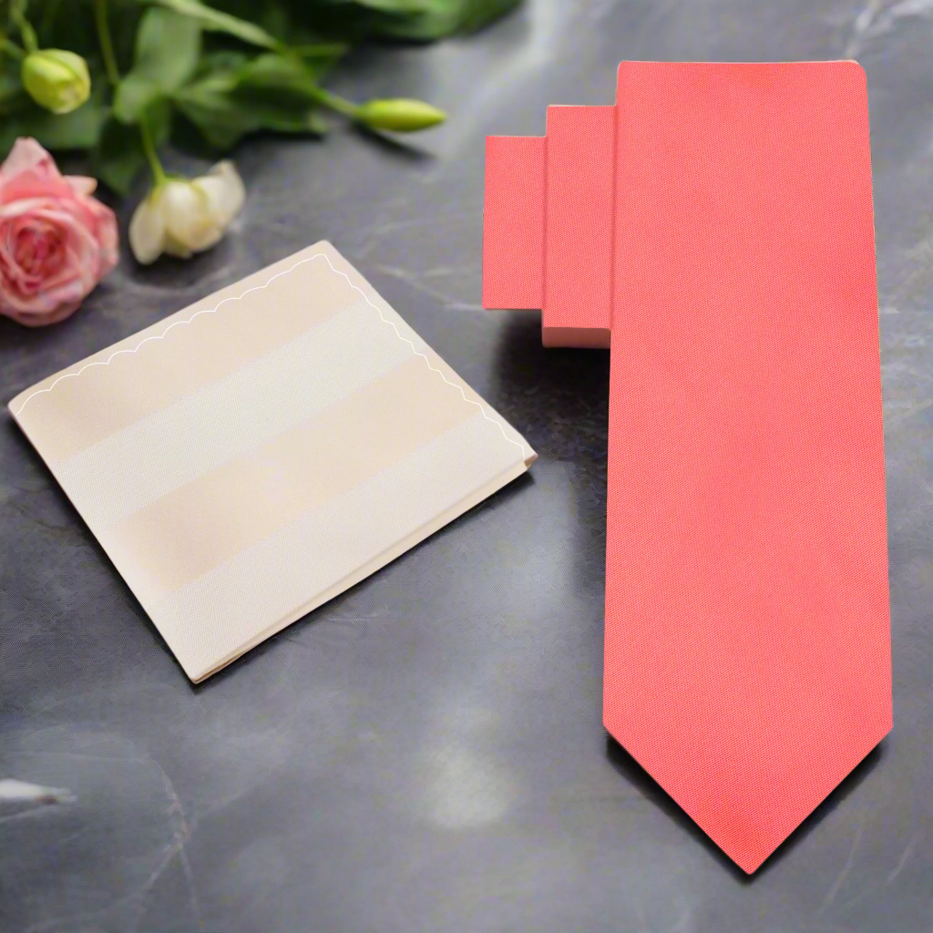 Elegant coral silk necktie in a classic knot for weddings