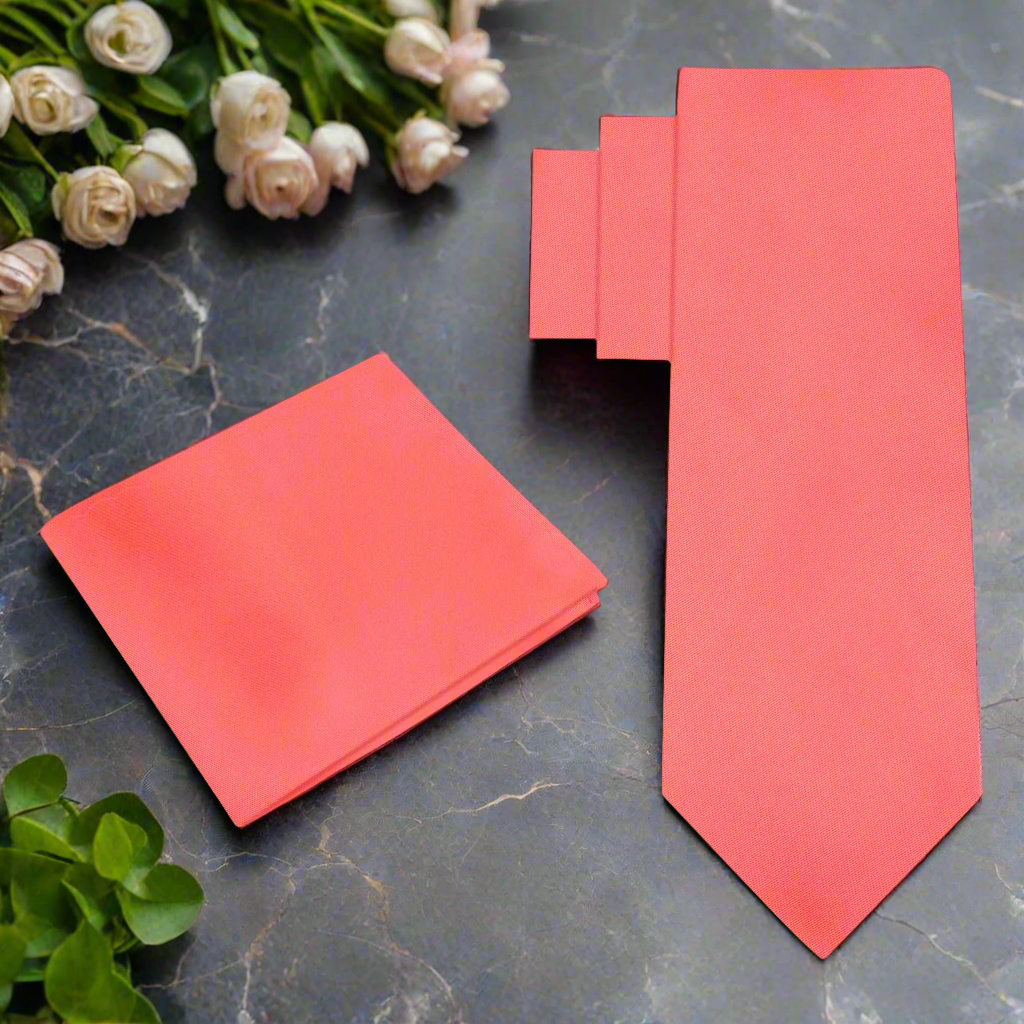 Elegant coral silk necktie in a classic knot for weddings