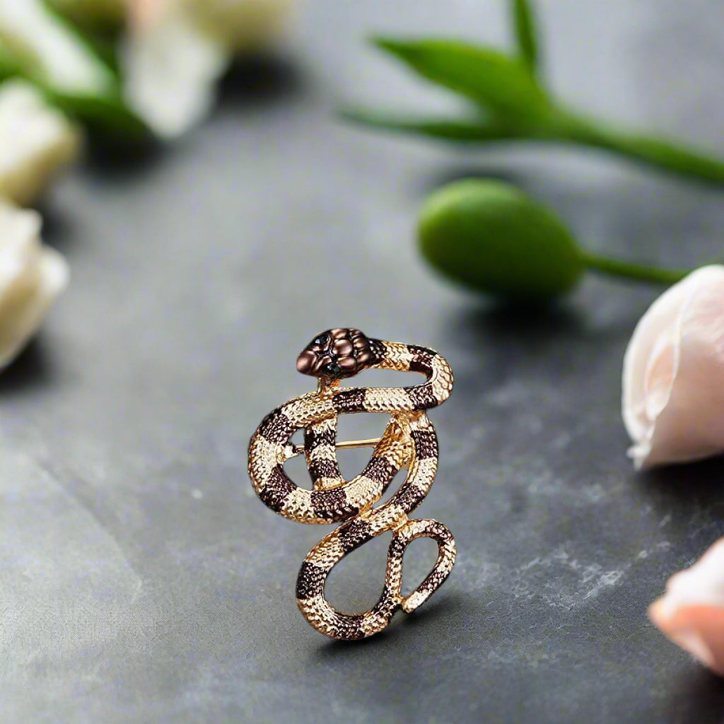 Gold snake lapel pin on a suit lapel for formal business events