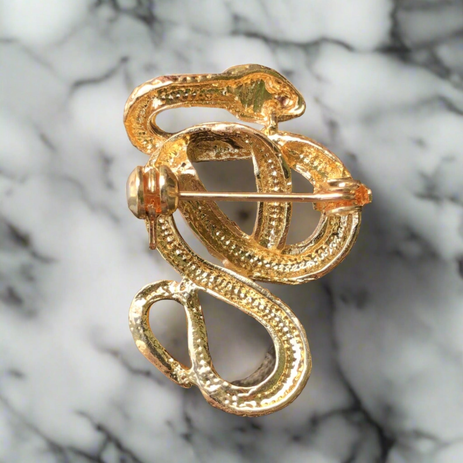 Close-up of a stylish snake pin, perfect for upscale occasions