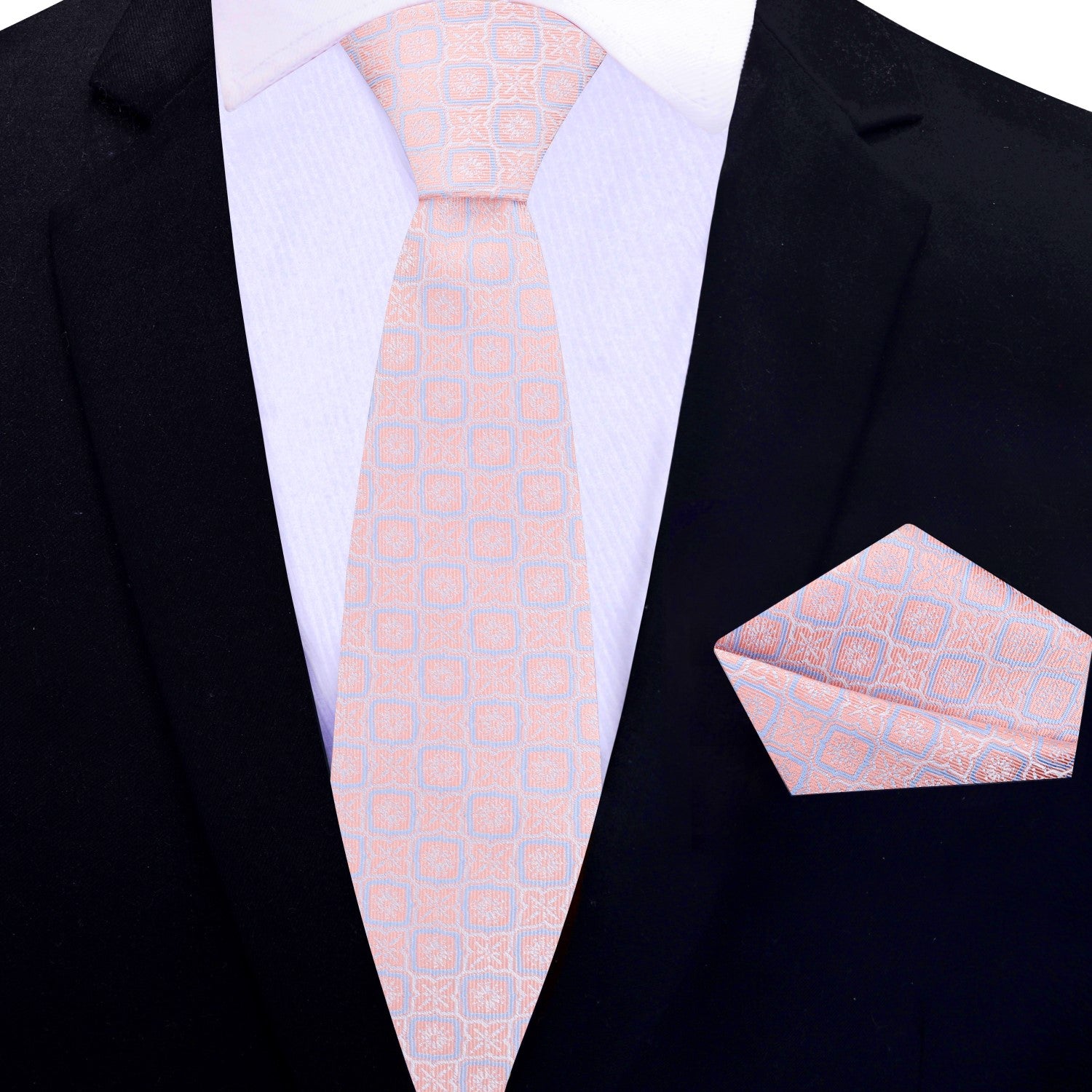 Silk necktie in peach pink with modern geometric design paired with formal suit
