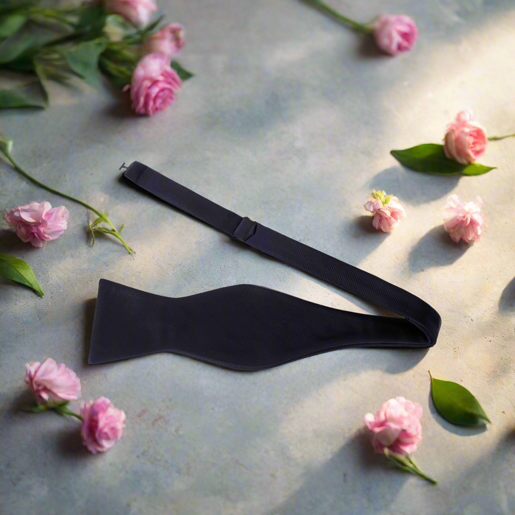 Classic solid color bow tie in royal blue, perfect for formal events.