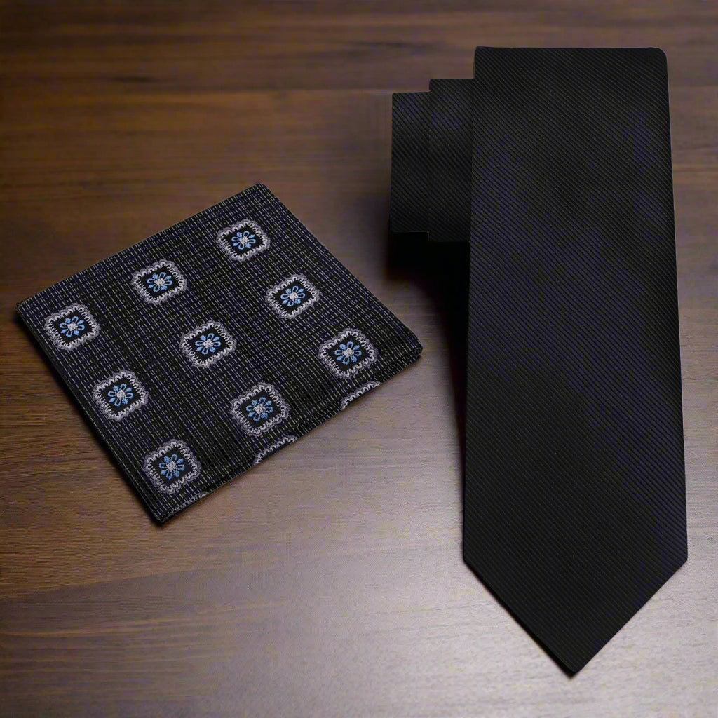 Close-up view of the Elegant Solid Black Silk Necktie showcasing its silky texture and solid design.