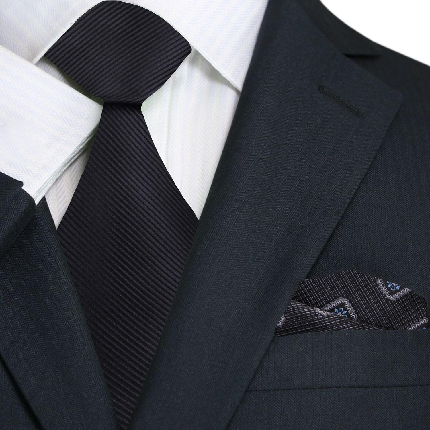Elegant Solid Black Silk Necktie worn with a white dress shirt and dark suit for a formal event.