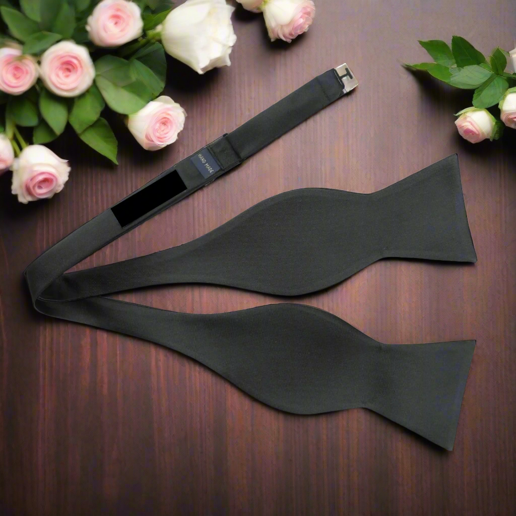 Close-up of shiny white tuxedo bow tie for weddings