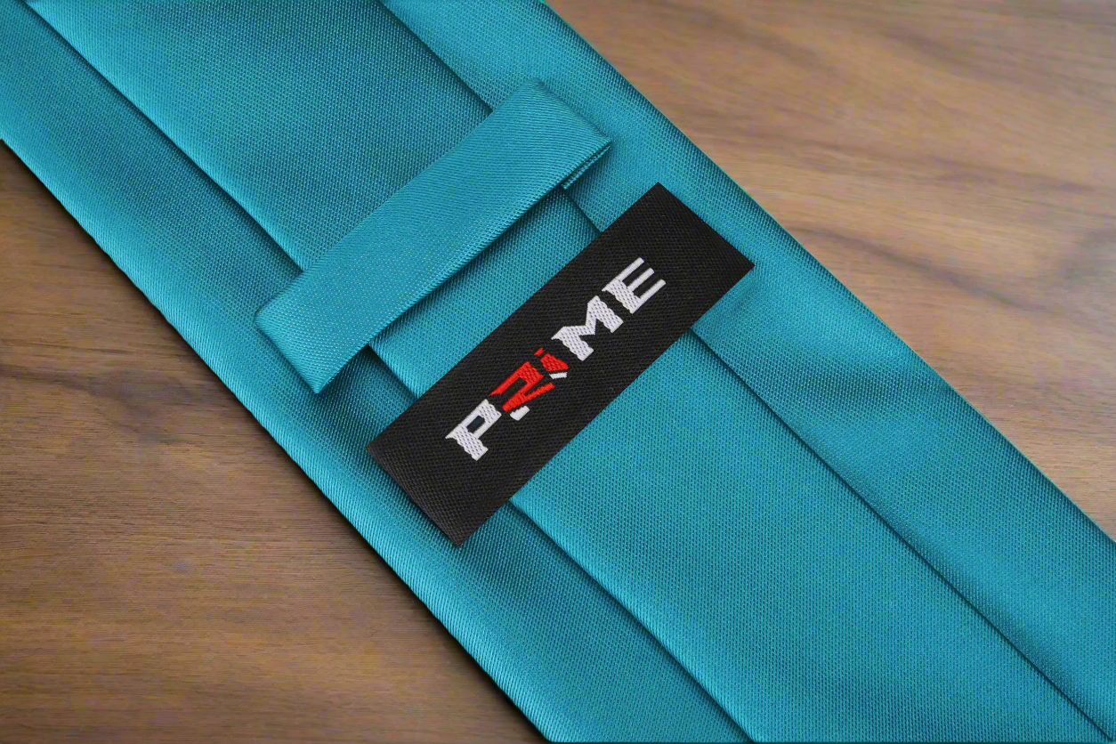 Close-up of the Caribbean Elegance Silk Tie fabric, highlighting its smooth texture and luxurious silk finish.