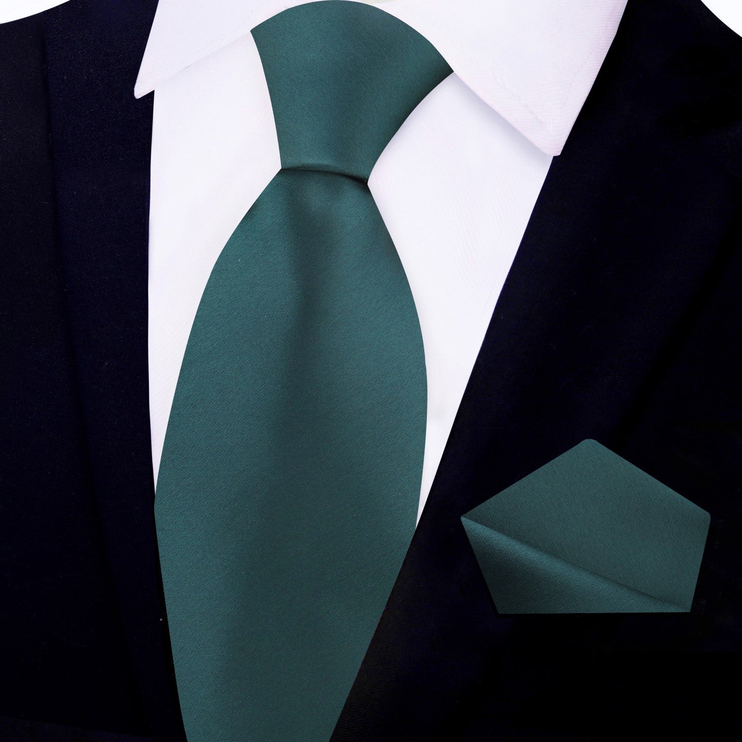 Men wearing a green silk tie paired with navy suit for wedding attire