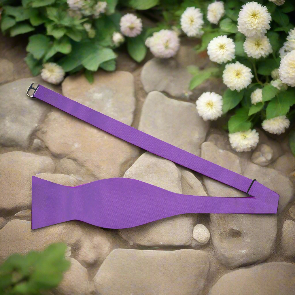 Elegant purple bow tie matching formal attire for wedding or special event