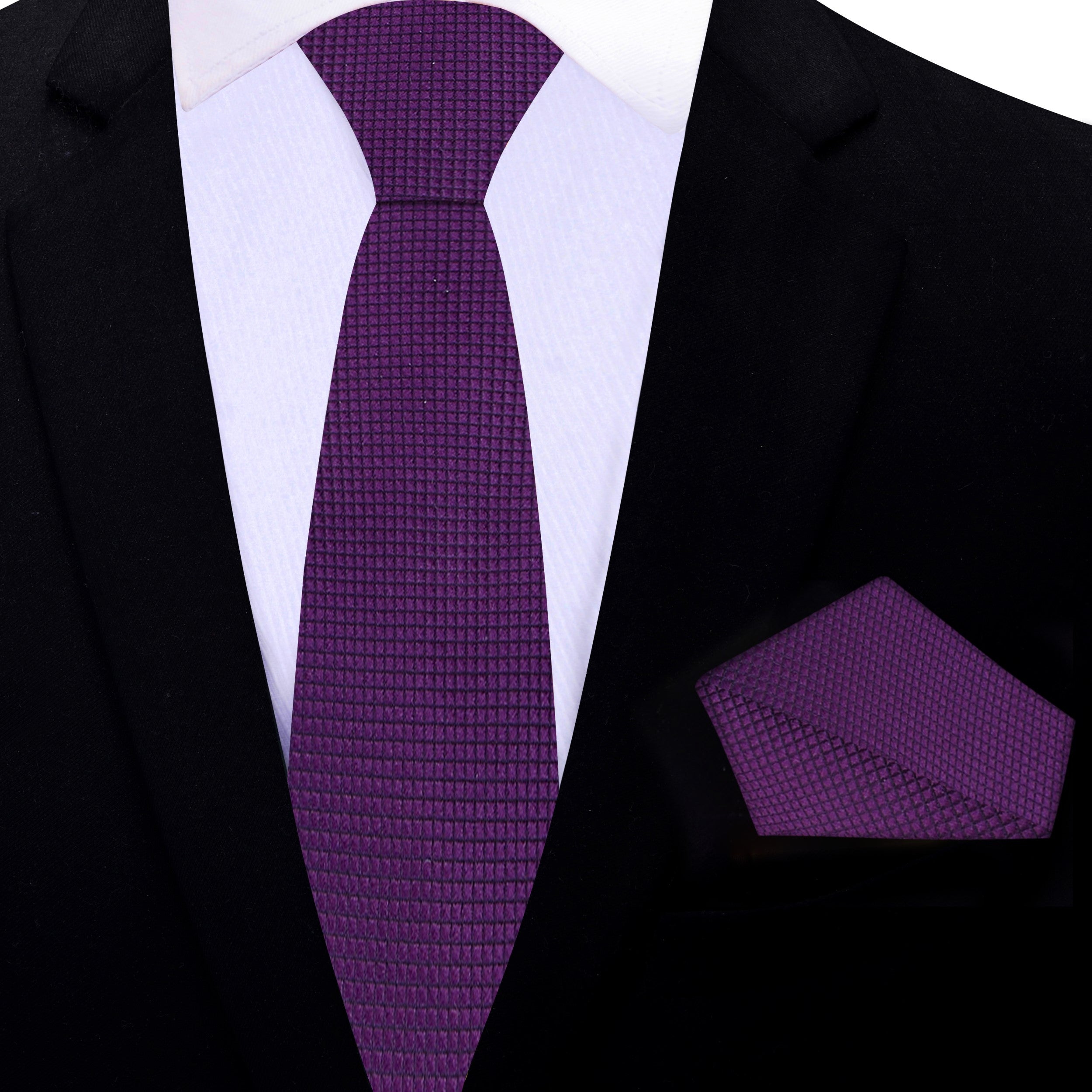 Flat lay of a purple silk tie next to a matching pocket square, ideal for professional attire