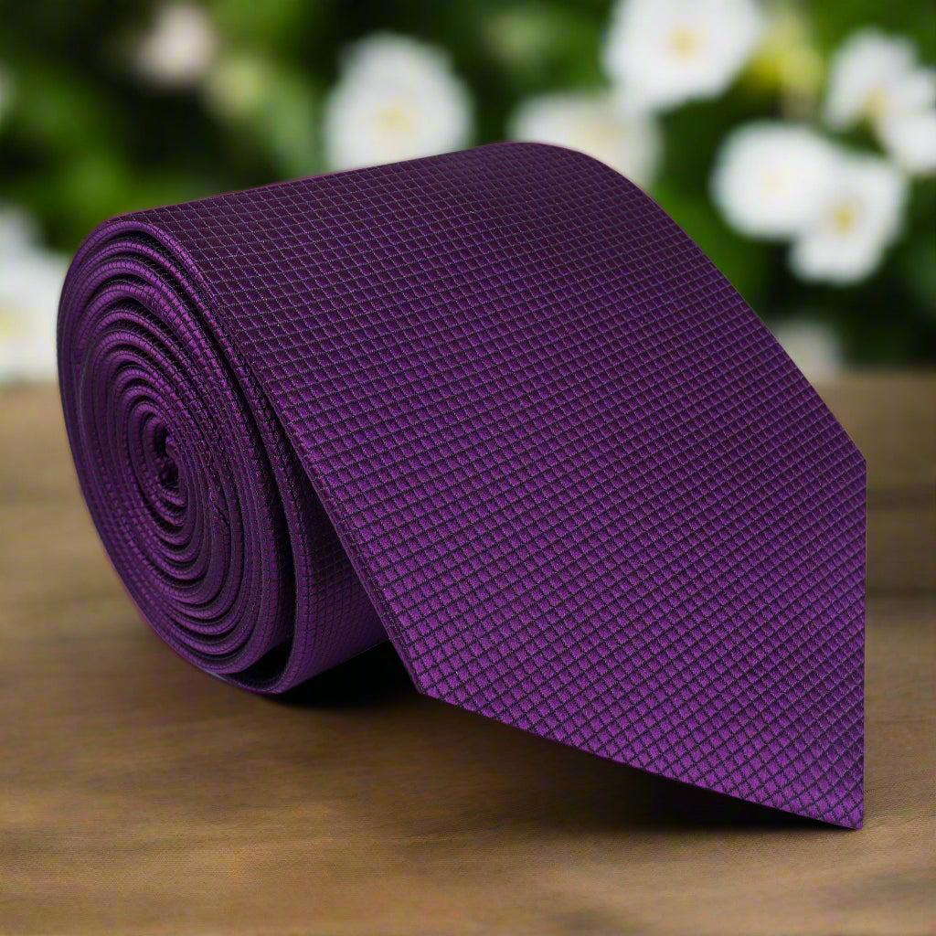 Close-up of a deep purple silk tie showing its smooth texture and rich color, great for office wear