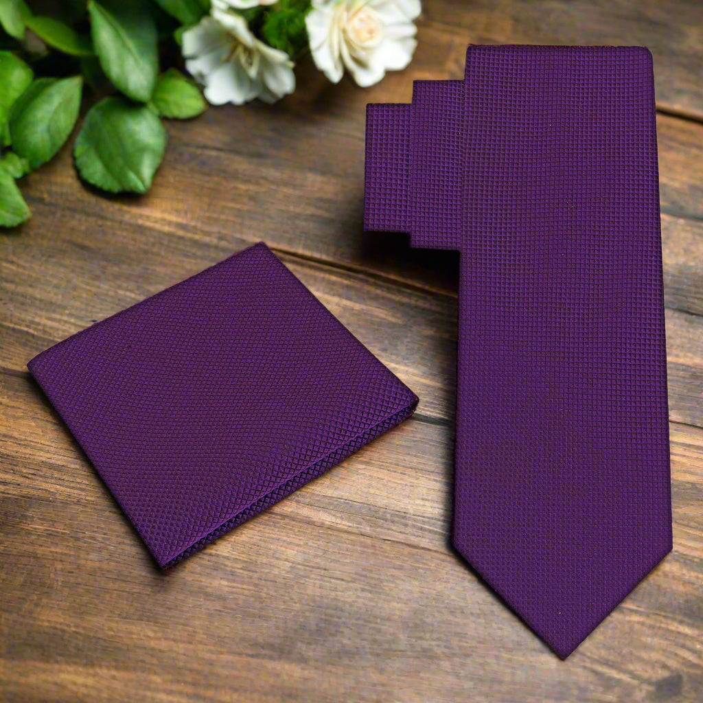 Close-up of a deep purple silk tie showing its smooth texture and rich color, great for office wear