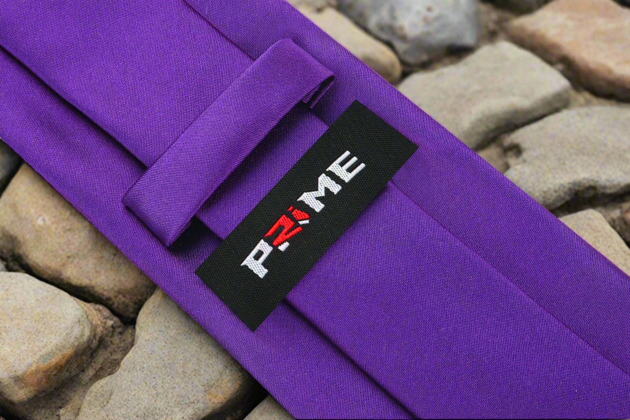 Elegant purple necktie on a hanger, showcasing its rich color and smooth silk texture