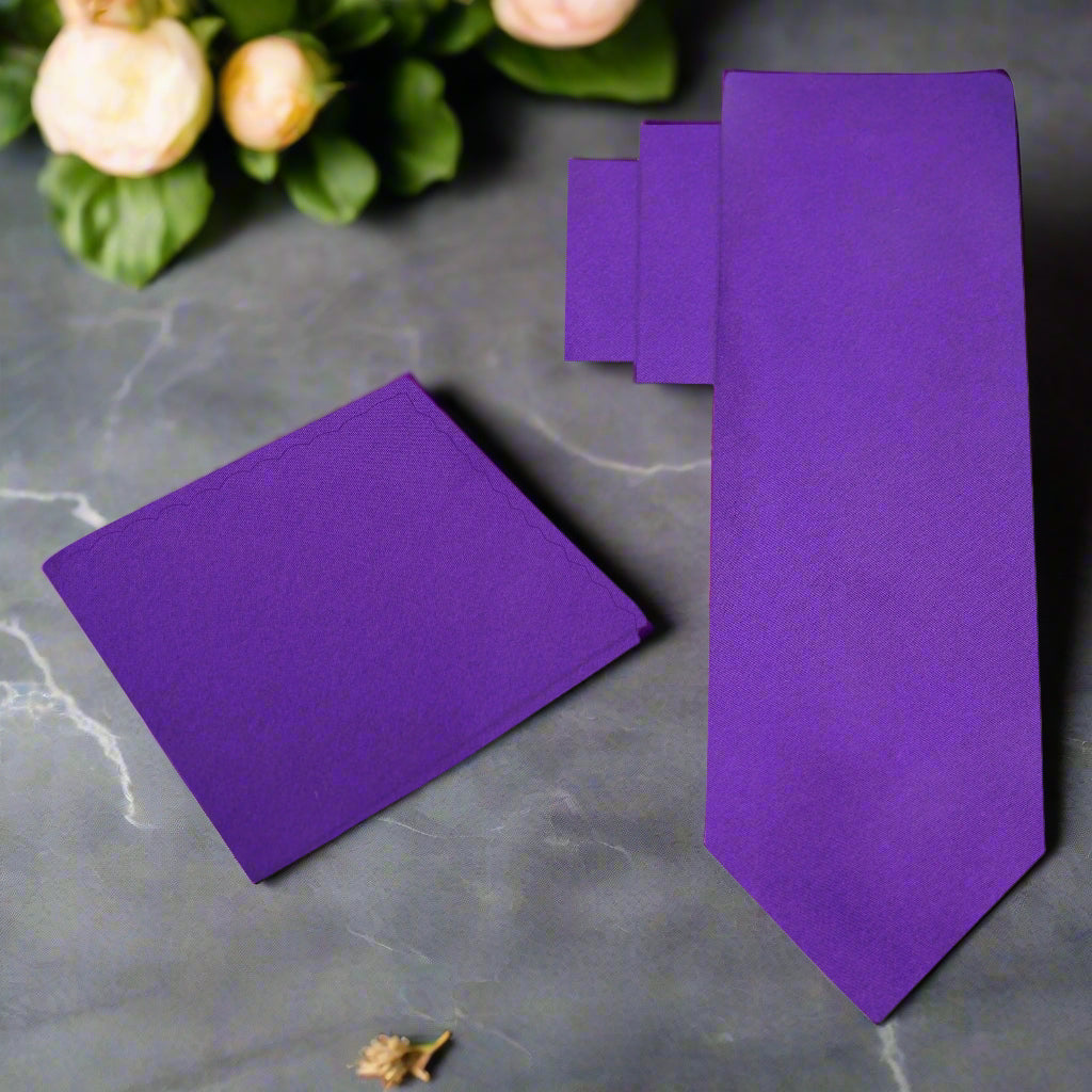 Mens purple silk necktie styled with a white shirt and navy suit for a wedding