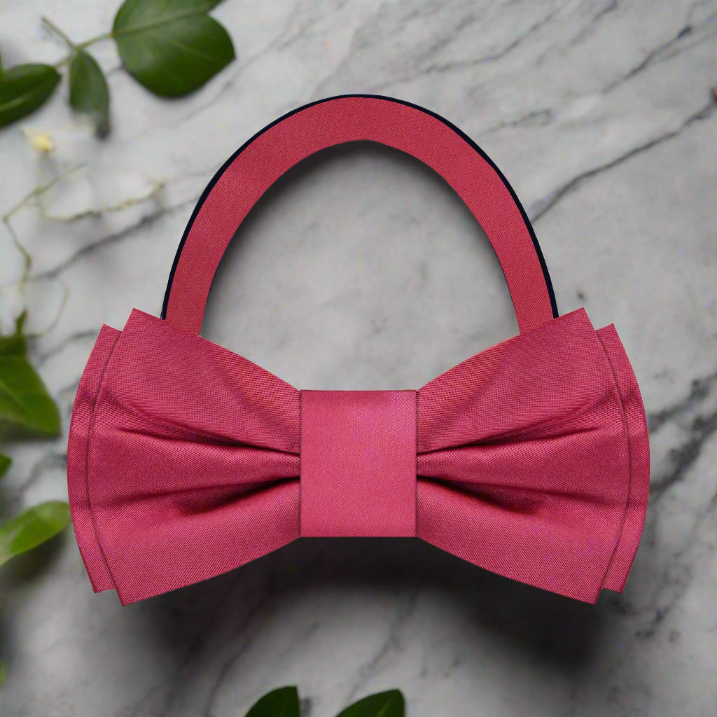 Close-up of the elegant deep red silk bow tie against a white background, showcasing its rich color and silk texture.