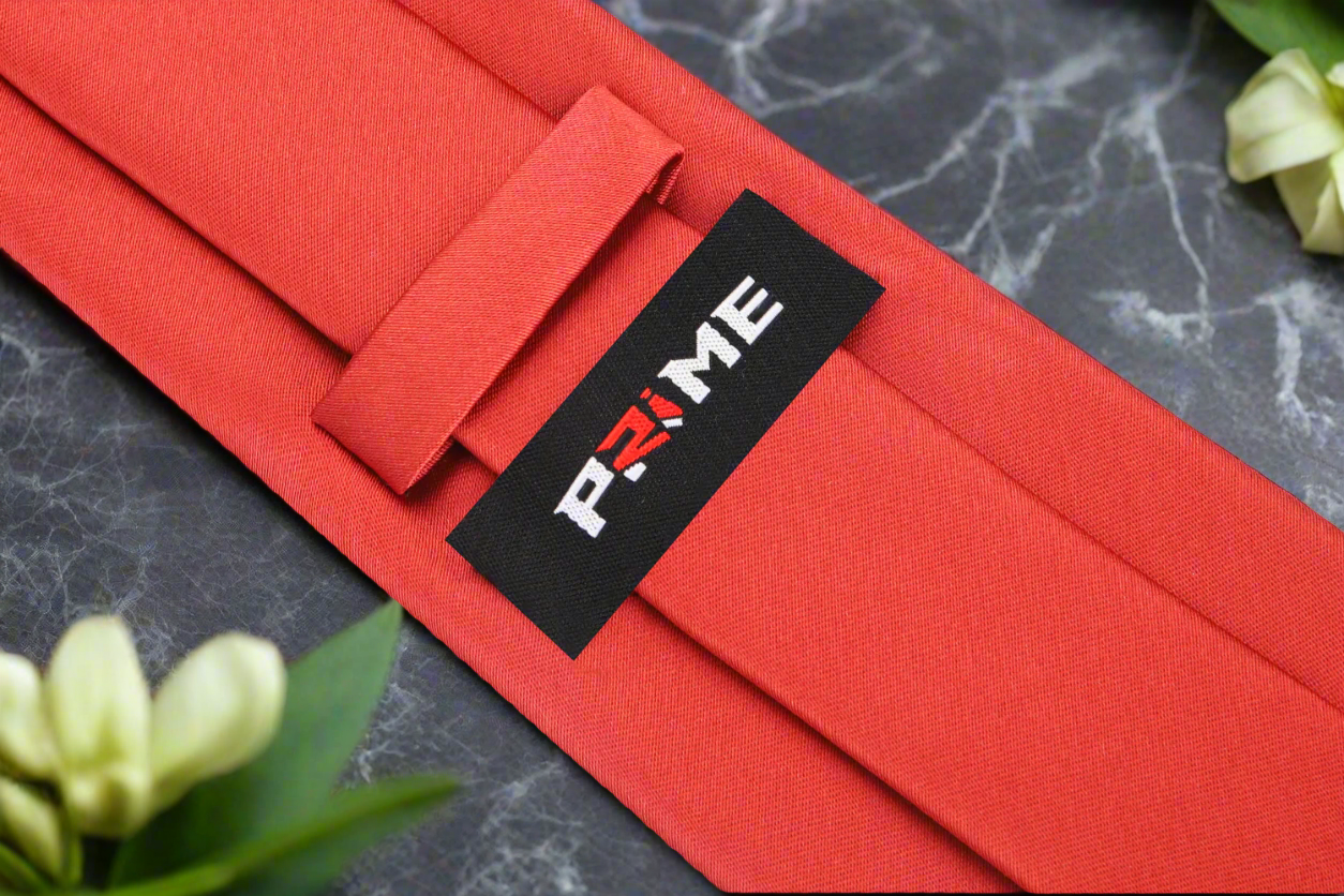 Elegant Solid Red Silk Necktie with a matching pocket square, set against a classic white dress shirt.
