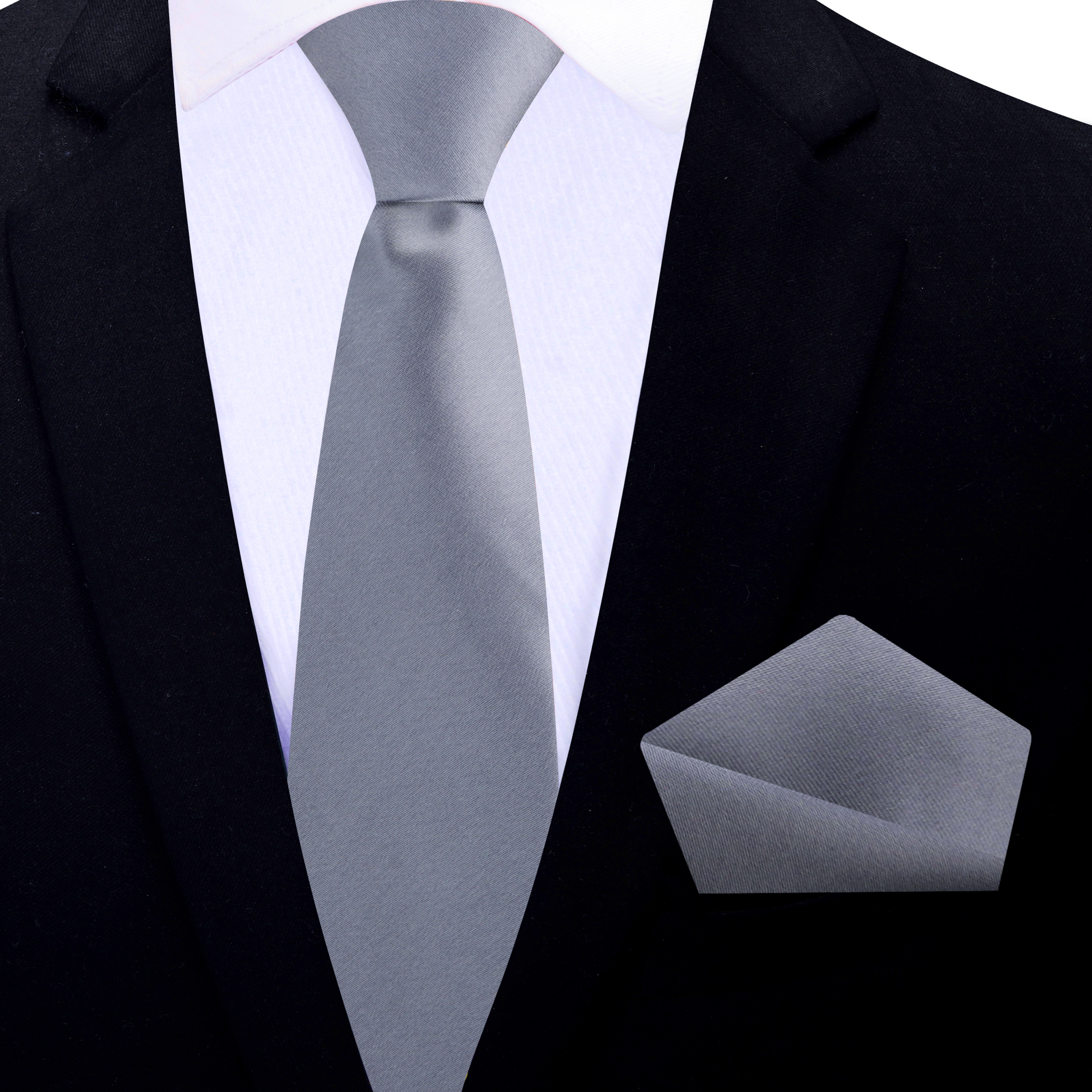 Stylish silver silk necktie paired with a charcoal grey suit, representing refined professionalism.