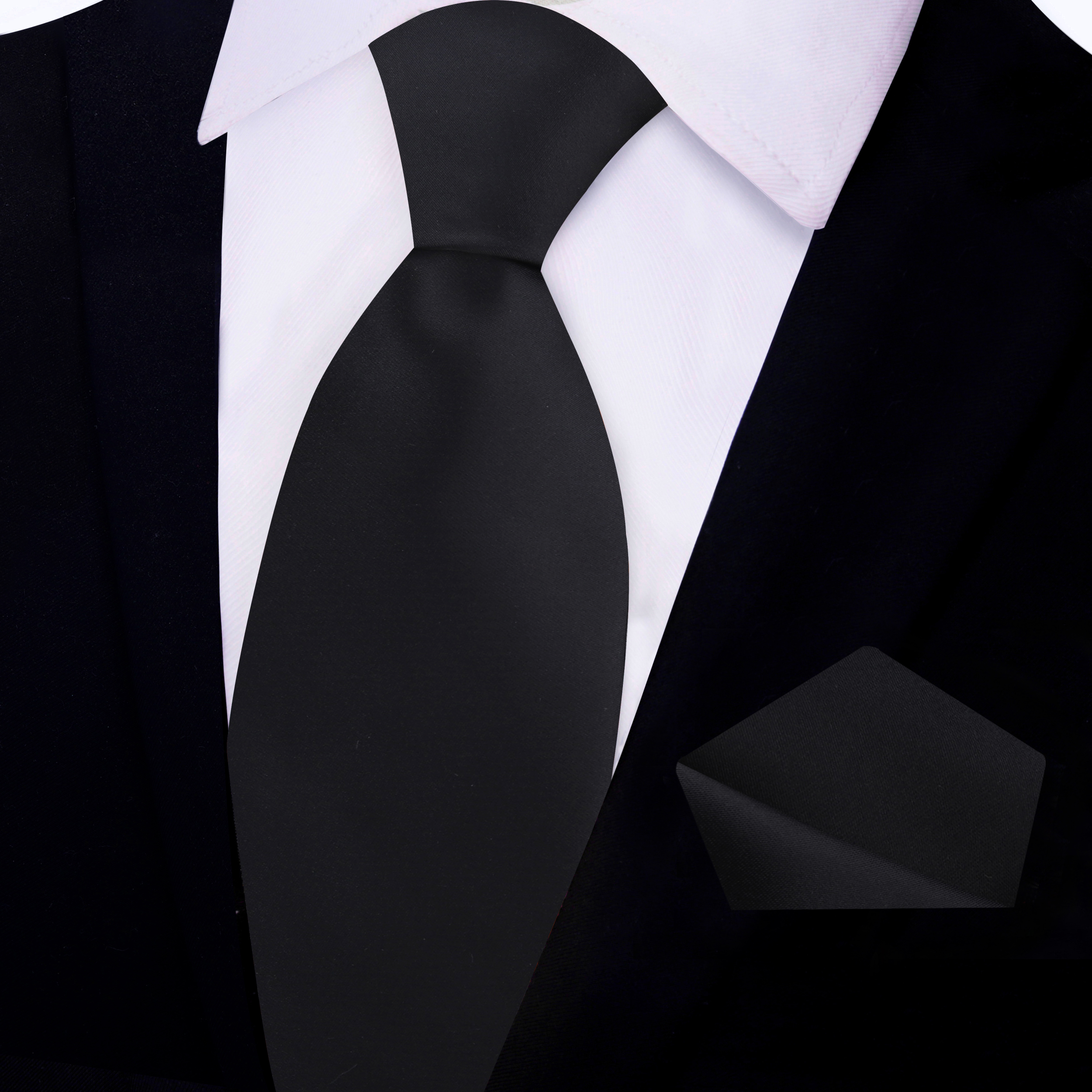 Elegant black tie draped over a dress shirt for formal occasions