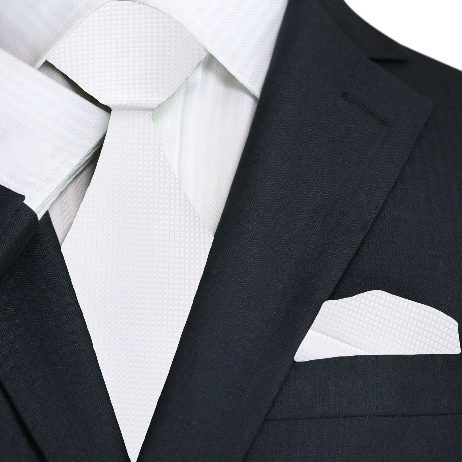 A man wearing a white dress shirt and solid red silk tie for a business or wedding event
