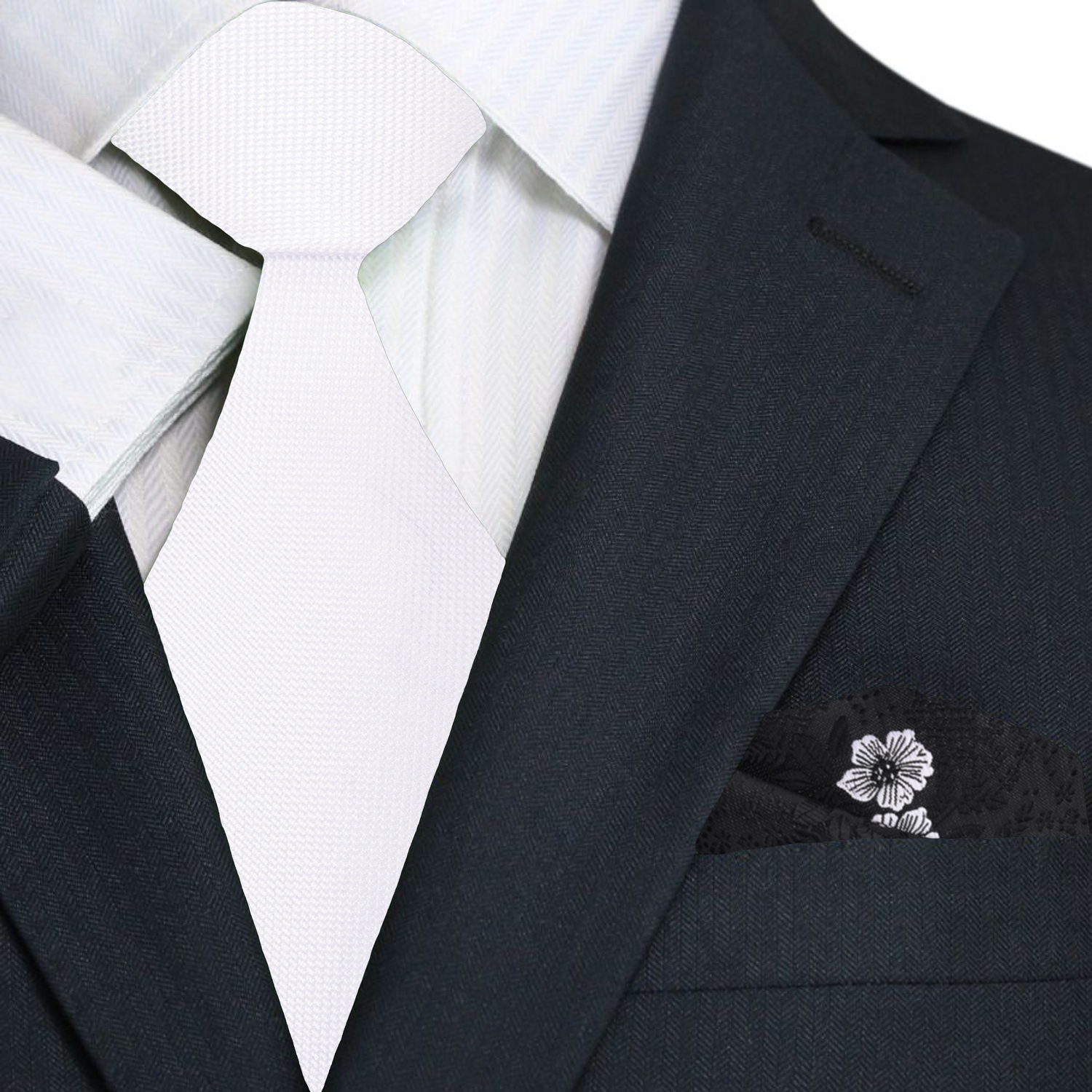 Close-up of the solid white necktie showcasing its luxurious silk texture.