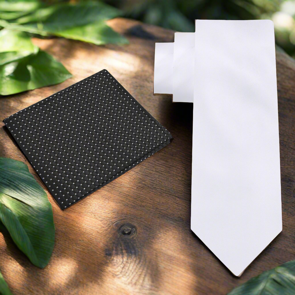 Elegant solid white silk necktie displayed on a formal shirt for weddings