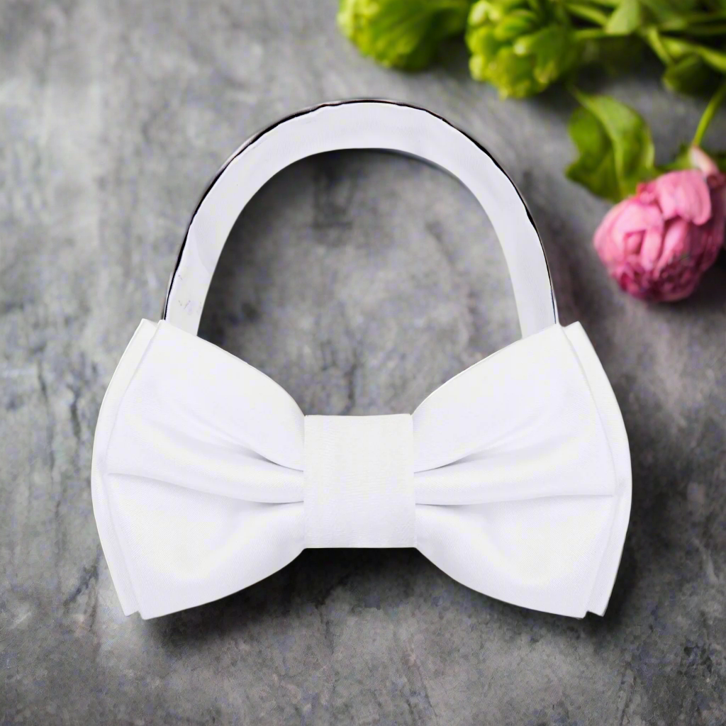 Elegant burgundy solid color bow tie paired with a crisp white shirt.