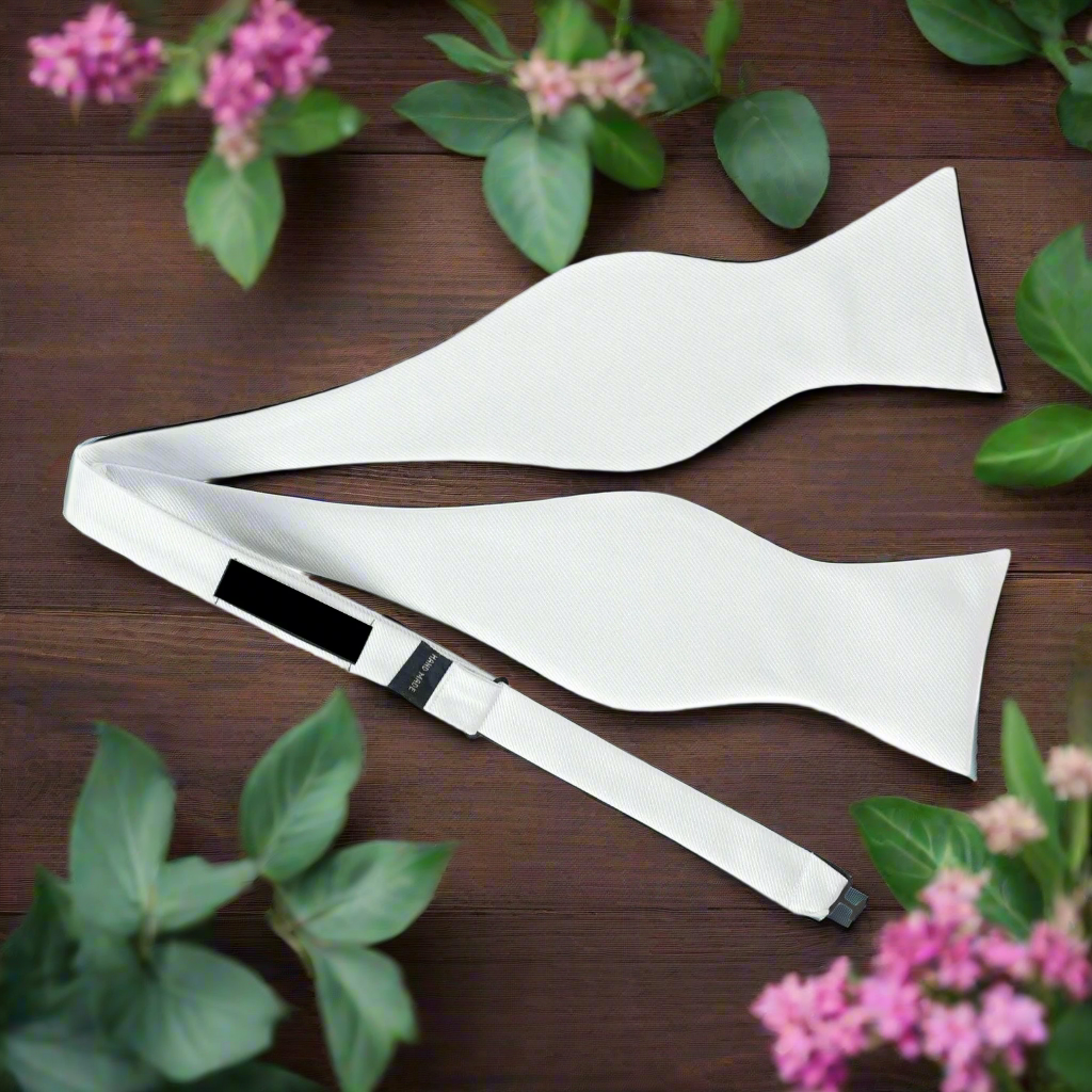 Close-up of shiny white tuxedo bow tie for weddings