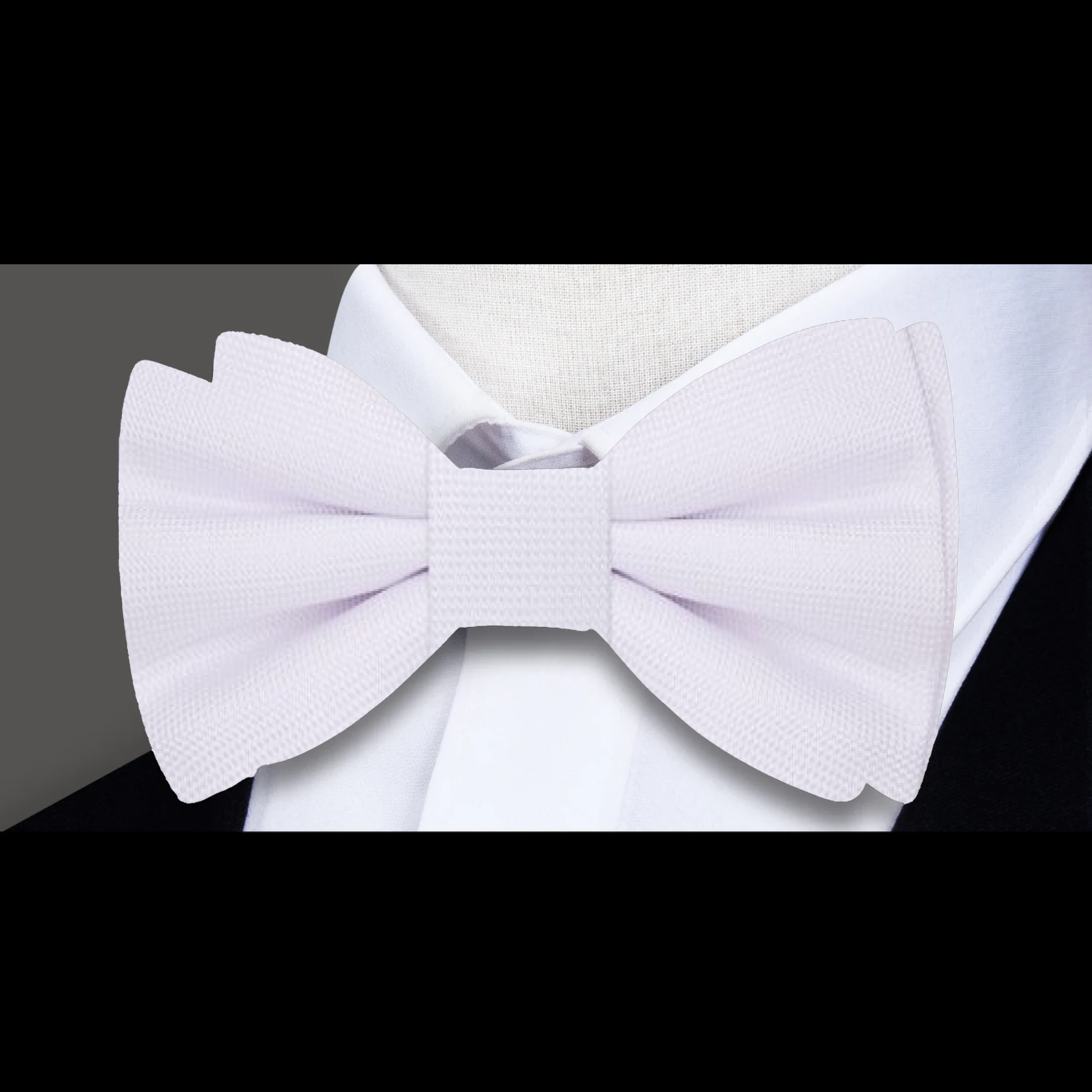 Matching pocket square with a navy blue bow tie, ideal for business meetings.
