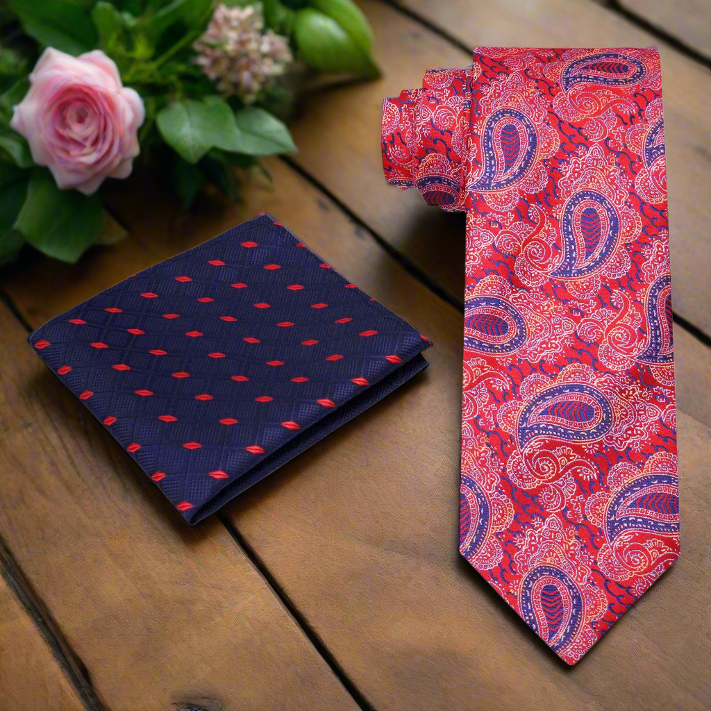 Close-up of the intricate paisley pattern on a red and blue silk necktie