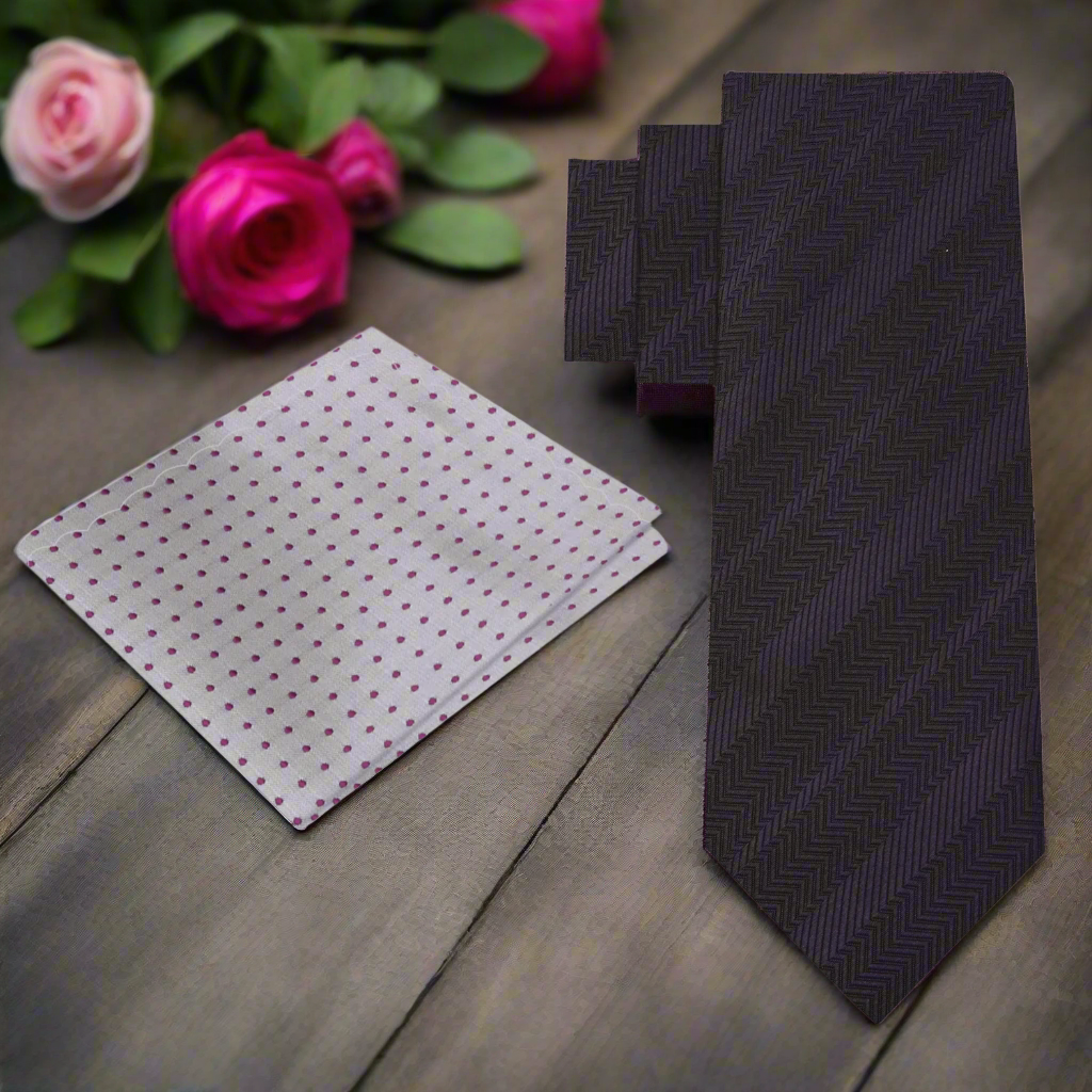 Elegant dark charcoal silk tie displayed on a white dress shirt, showcasing its texture.