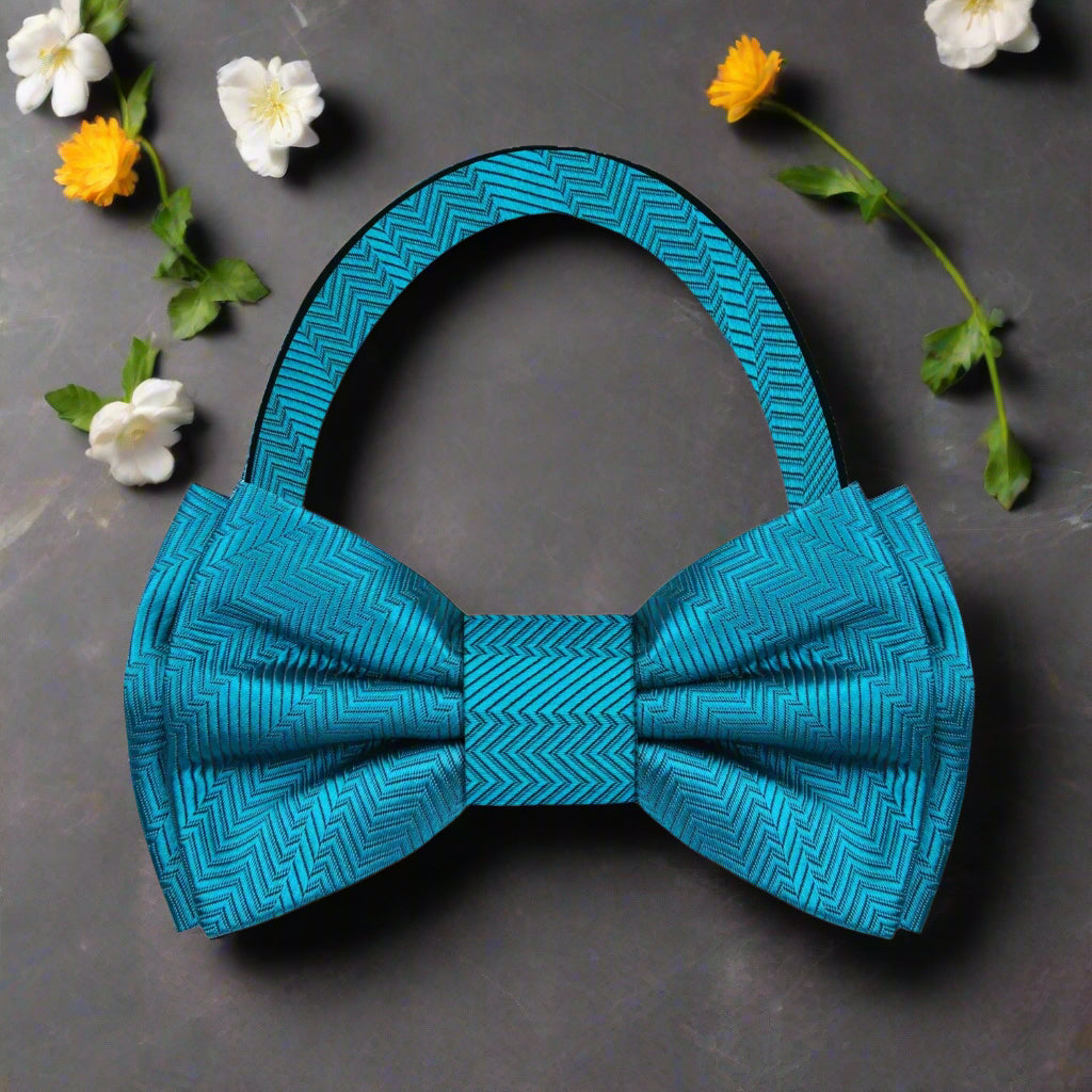 Flat lay of various green bow ties, including shamrock and deep teal, perfect for any formal wear.